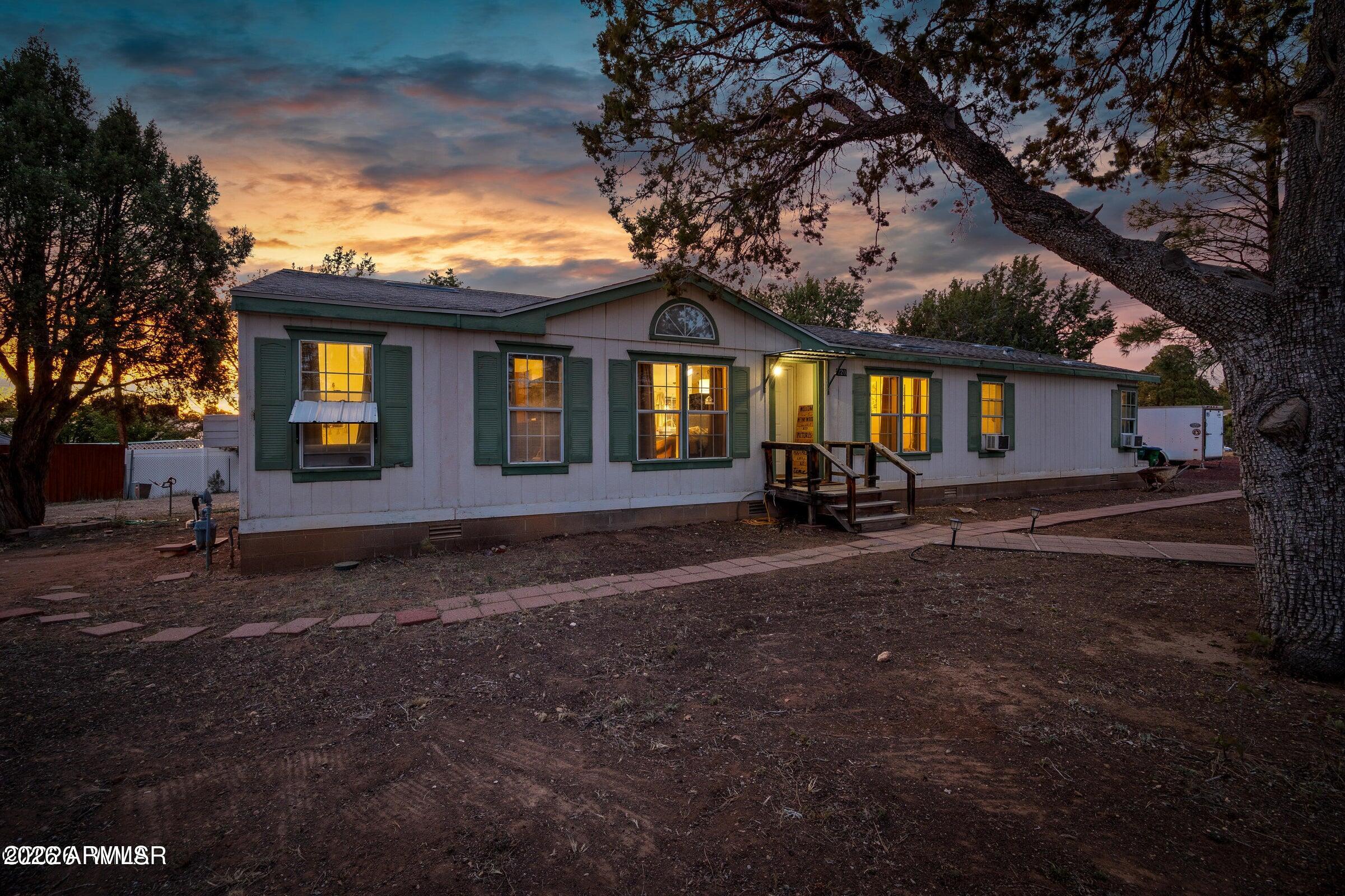 Spacious 5-bedroom, 2-bath manufactured home situated on .66 acres in the heart of Show Low! Offering plenty of room inside and out, this property features a functional floor plan, generous living space, and endless potential for families, investors, or those needing extra space. Enjoy the convenience of in-town living with shopping, schools, restaurants, and amenities just minutes away--all while having room to spread out. No HOA, giving you flexibility and freedom rarely found in town. Plus, enjoy the best of the White Mountains lifestyle with skiing just 40 minutes away at Sunrise Park Resort and countless nearby lakes for fishing, kayaking, boating, and outdoor adventure year-round. A great opportunity to own a large parcel with space for toys, gardening, pets, or future possibilities!