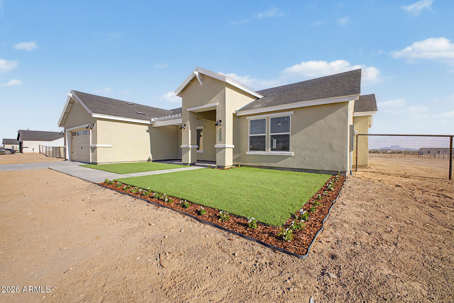 PRIME LOCATION | BRAND NEW | 1.16 ACRES • Modern ranch home on a FULLY FENCED lot just off Van Buren St. • 4 beds | 3 baths | TWO master suites • Open-concept layout with vaulted ceilings • Electric fireplace in great room • Modern kitchen with stainless steel appliances + LED lighting • 1-lite French doors with built-in blinds to large covered back porch • Mud room + blinds on all windows • Turf & landscaping in front yard • Large RV gate + room for RVs, toys & more • Spray foam insulation for energy efficiency • 2-year builder warranty included Brand new. Loaded with upgrades. Move-in ready.