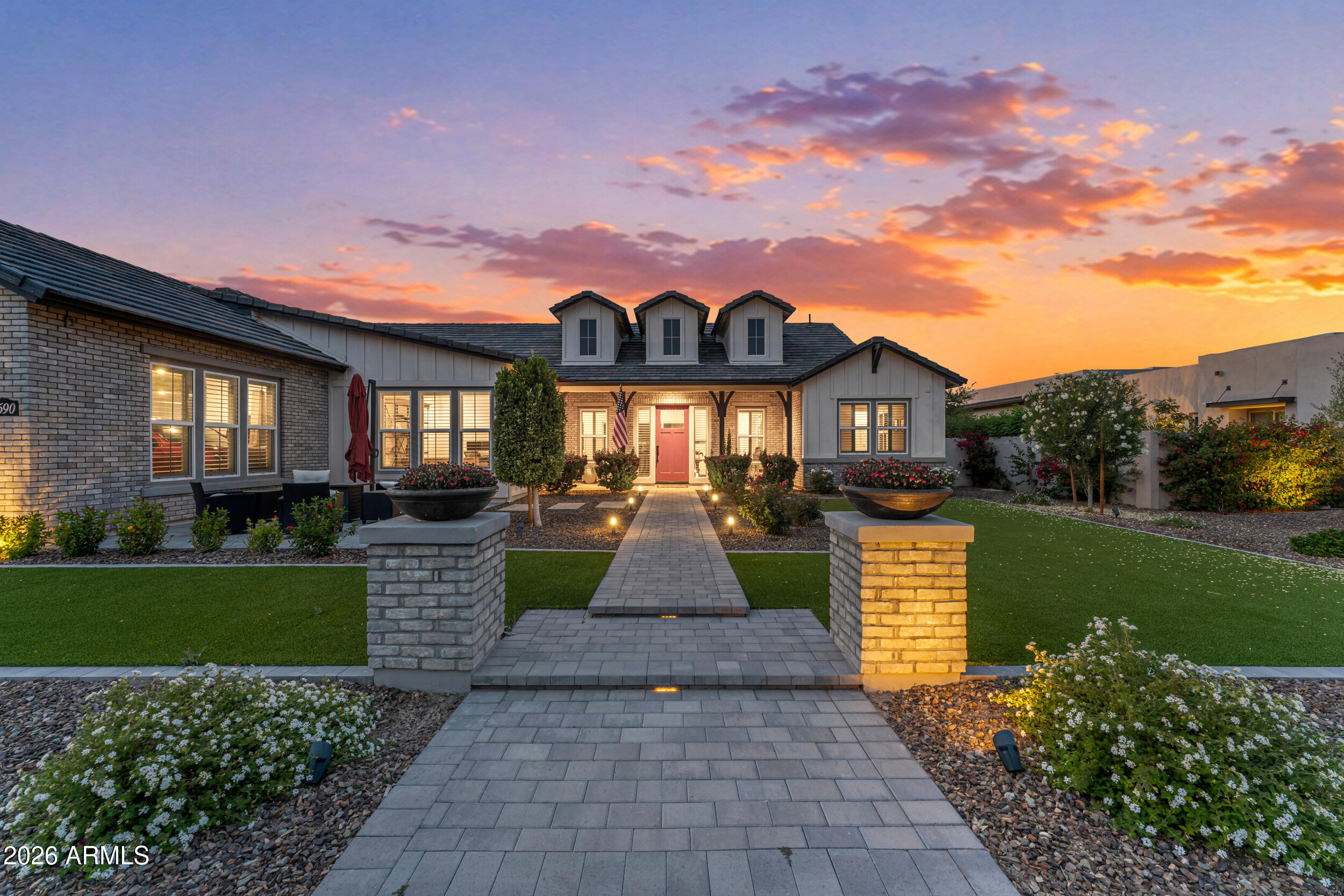 Unparalleled luxury awaits in this impeccably appointed Toll Brothers single-level estate within the gated Whitewing enclave at Whisper Ranch. An extraordinary floor plan features generous living spaces, tall ceilings, and two versatile bonus rooms, designed for effortless entertaining and everyday comfort.

A dramatic foyer welcomes you with abundant natural light and leads to an open-concept great room anchored by a multi-panel sliding glass wall that dissolves the line between interior and exterior. The chef's kitchen is a true focal point with an oversized quartz island, premium stainless appliances, double ovens, gas cooktop and custom cabinetry, beautifully balanced for performance and presentation.

The primary suite is a serene spa retreat with a luxurious soaking tub, expansiv walk-in shower, dual designer vanities and an oversized custom closet. Additional well-appointed bedrooms and flexible bonus rooms adapt easily to a home office, media room or gym.

Outside, resort-quality living unfolds with a sparkling pool, gas fireplace, covered patio, low-maintenance lush turf and broad areas for lounging and entertaining beneath Arizona skies. Practical luxuries include a four-car garage and high-end finishes throughout.

Set in Queen Creek, this residence pairs refined design with community charm, including scenic equestrian trails, seasonal events, and award-winning parks and schools. The neighborhood offers a community space, a dog park and friendly neighbors. Whisper Ranch provides privacy and resort-style living while keeping the best of Queen Creek close at hand.