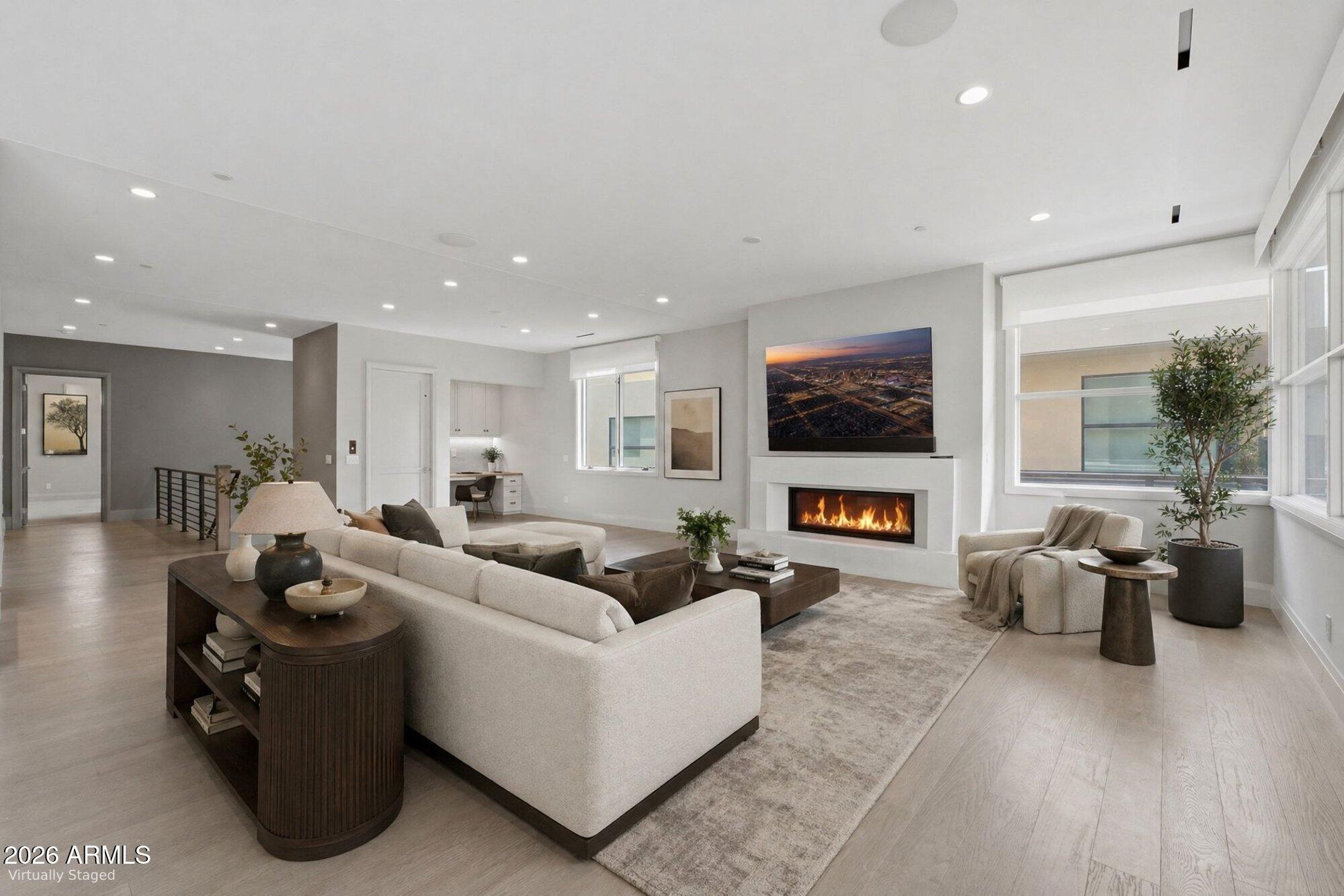 Set within the iconic Mountain Shadows Resort in Paradise Valley, this 3,620 sq ft residence embodies effortless resort-style living in one of Arizona's most coveted locations. Surrounded by the natural beauty of Camelback Mountain and moments from scenic hiking trails, the home also offers convenient access to premier shopping and dining. All living spaces are thoughtfully arranged on a single level, reached by private elevator or stairs, creating a seamless and sophisticated arrival. Expansive sliding doors open to a covered terrace with fireplace, blending indoor and outdoor living against a dramatic mountain backdrop. Designed for both comfort and entertaining, with access to exceptional resort amenities, this is desert living at its finest.