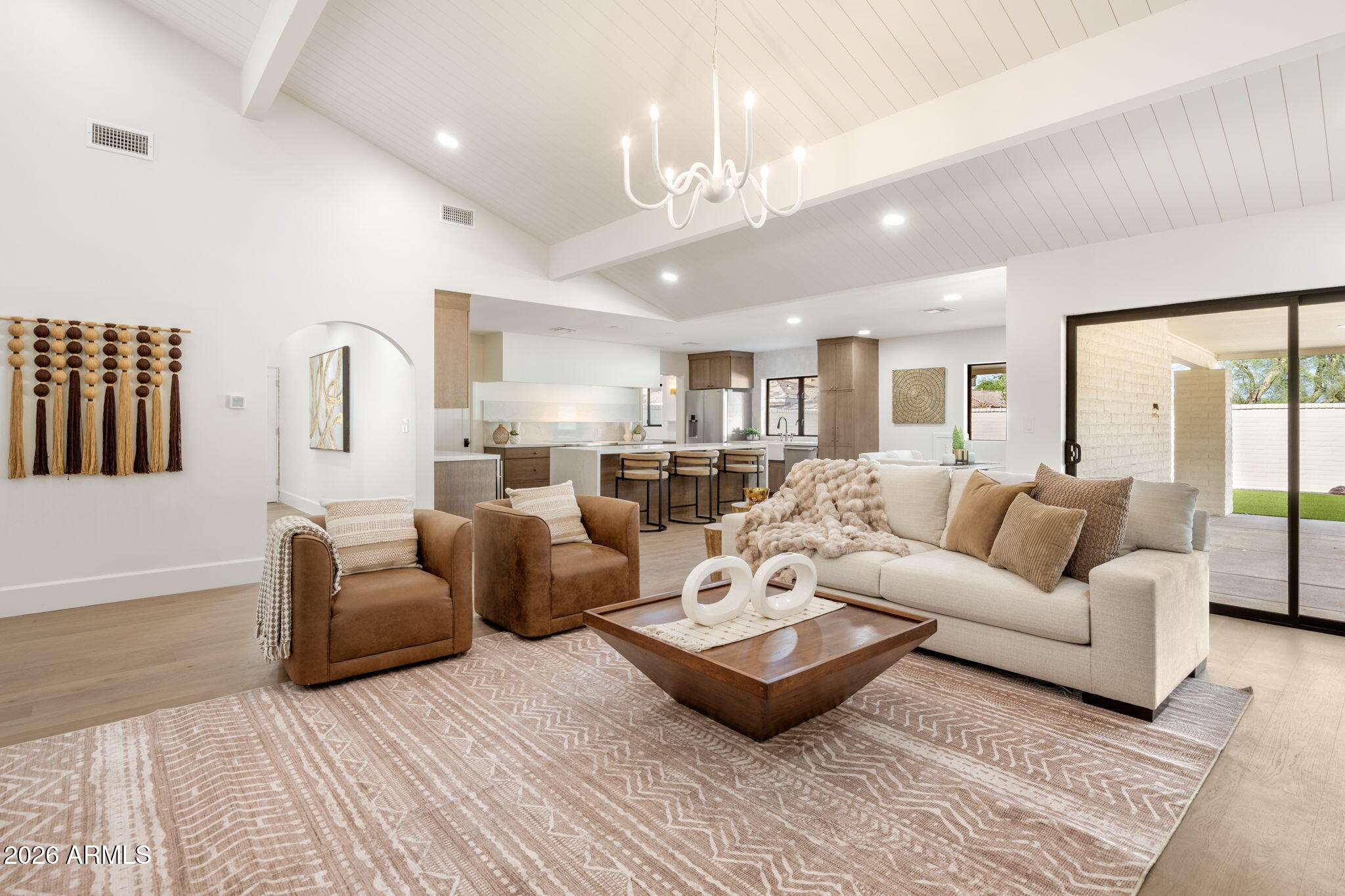 Enjoy walking distance to over 30 restaurants in Scottsdale Houston's, Fat Ox, grocery stores, including AJs and Trader Joes and much more!  Walking paths and golf course access a few steps away. From the moment you arrive, the home makes a lasting impression. A striking design sets the tone, while thoughtfully selected lighting adds warmth and cohesion throughout. Outside camelback mountain views enhance the home's inviting, old-world charm. Inspired by the relaxed elegance of a European touch, this residence seamlessly blends timeless materials with refined, modern design. The kitchen is a true showpiece, featuring quartz countertops, polished high end fixtures, appliances ensure exceptional performance, making this open-concept, chef's kitchen as functional as it is beautiful--perfect for entertaining. A Large walk-in pantry! Warm hardwood flooring flows throughout, adding richness and continuity to every space. THREE PRIMARY SUITES offers a serene, spa-like retreat designed for ultimate relaxation, while each additional bedroom includes its own private en-suite bath for comfort and privacy. Sliding glass doors create effortless indoor-outdoor living, opening to a resort-style backyard oasis. Multiple covered patios camelback views and a large lot on a cul-de-sac. LARGE LOT, NEW ROOF NEW AC SYSTEM WINDOWS AND MUCH MORE!  This is a rare opportunity to own a truly one-of-a-kind luxury home in one of most coveted locations. Don't miss your chance to make it yours. Residents enjoy community tennis/pickleball courts, pool & spa, and thoughtfully-designed clubhouse.