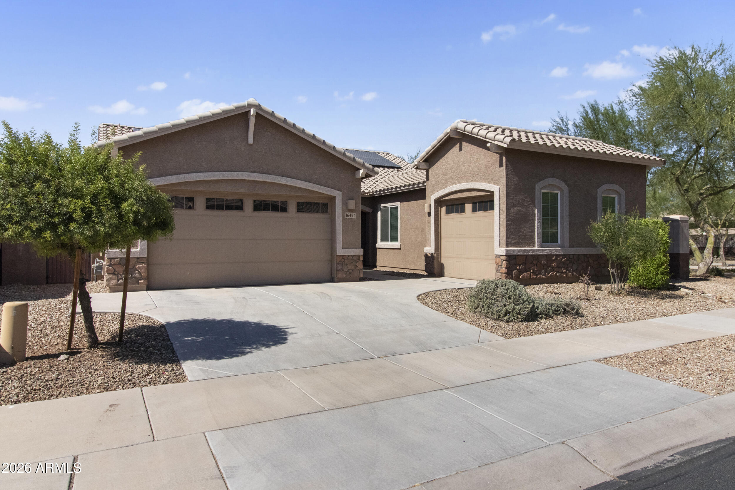 Welcome to this beautifully designed 4-bedroom, 3-bath home featuring a spacious open-concept floor plan perfect for modern living and entertaining. Enjoy elegant tile flooring throughout the main living areas, a stunning kitchen with white shaker cabinets, and abundant storage with walk-in closets in every bedroom.

Step outside to your private backyard oasis complete with a sparkling pool, low-maintenance turf, and a covered patio with double doors that seamlessly connect indoor and outdoor living spaces. The primary suite offers direct backyard access, creating the perfect retreat.

This energy-efficient home includes fully paid-off solar, helping keep utility costs low. Plus, the flexible Next Gen option provides excellent potential for multigenerational living, guests, or a privat home office setup. Combining style, functionality, and energy savings, this exceptional home is ready for its next owner. Minutes from the 303 freeway with tons of shopping nearby. Don't miss them gem!