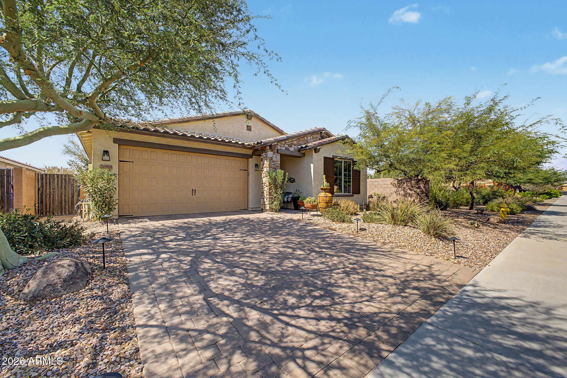 Embrace the vibrant, active lifestyle of Adora Trails in this meticulously maintained 2,044 sq ft home! Nestled near the San Tan Mountains, you'll enjoy 12+ miles of trails, a fishing lake, and a resort pool. The home sits on a choice lot with no rear neighbors and side green space. Inside, discover a flexible 3-bed + den layout featuring wood-look tile and a chef's kitchen boasting quartz counters and all-new appliances within the last 2 years, including a Bosch fridge and dishwasher. The spectacular backyard hosts a heated/chilled pool (2021), fire pit, low-maintenance turf, and built-in surround sound. Complete with an EV charger, new water heater (2025), and top CUSD schools, this is Gilbert living at its finest!