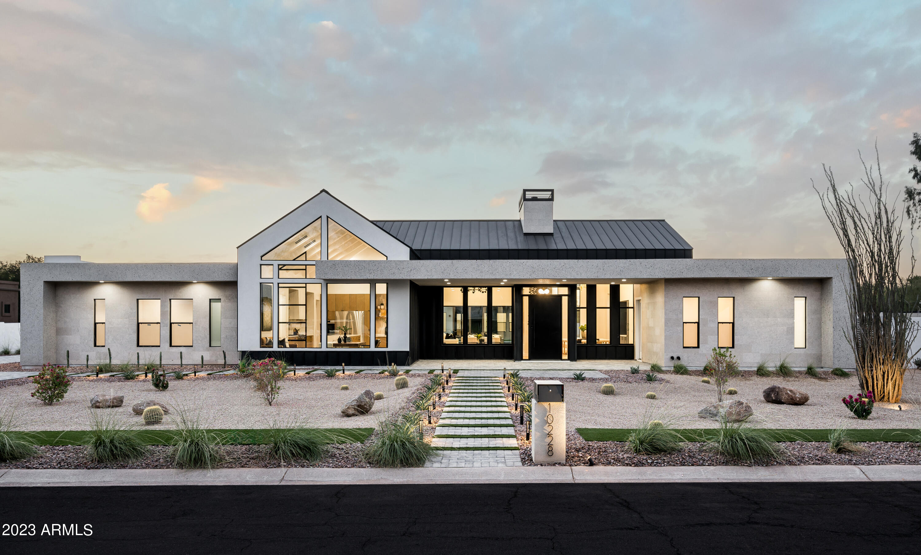 Discover CACTONIA, a stunning blend of farmhouse charm and contemporary luxury. This 7-bedroom, 6.5-bathroom residence sits on a sprawling 1+ acre estate, offering flexible living spaces to accommodate various lifestyles. The perfect harmony of metal and stone creates a unique ambiance that is both warm and sophisticated. With a separate guest house, this property is ideal for hosting guests or extended stays. Embrace the endless possibilities of the expansive grounds for sports courts, gardens, or additional garage space. CACTONIA is a masterpiece where timeless elegance meets modern comfort. It's not just a home; it's an invitation to live your dreams in style.