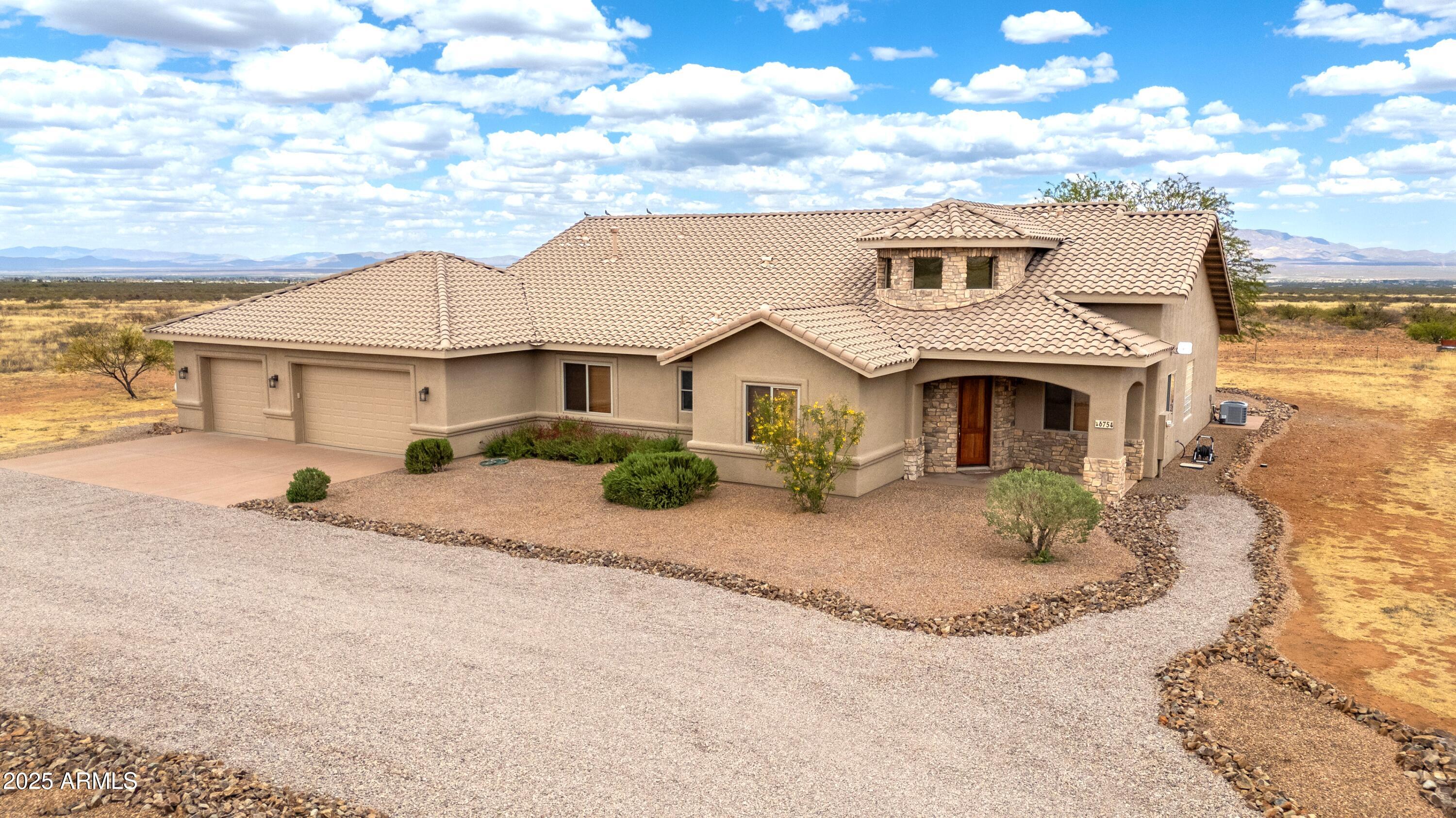 This impeccably crafted estate in prestigious La Pradera Estates exudes timeless elegance & modern comfort. From its striking architectural profile to the meticulous interior finishes, every detail feels freshly imagined. Spacious vaulted ceilings & Andersen windows frame sweeping panoramic vistas. Solid 2×6 construction with transferable home warranty for long-term peace of mind. Freshly painted inside and out & all floors re-stained. Gourmet kitchen complete with brand-new oven/stove & top quality Pelican water filter & reverse-osmosis system. Expansive garage with a dedicated workshop/storage area. Being sold with 3 added acres for ultimate privacy & development flexibility. Experience the rare combination of architectural distinction, turnkey luxury, & 360* mountain views on 6 acres.