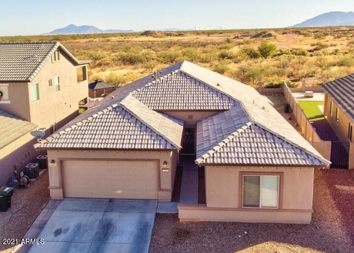 Come home to stunning open concept home. This property is located in the highly desired neighborhood of Chaparral Village, even backing up to open land for added privacy. The home is 3 bedrooms, DEN and 2 bathrooms. The living space welcomes you with combined eat in dining, living and kitchen.  Kitchen is finished brand new appliances (purchased and installed 12/2021) to include dishwasher, stove and fridge. Primary suite is off the kitchen and split from the additional rooms and features large walk in closet and on-suite. Outside you will find you private get away. Irrigation system installed last year for grass area. Open to the gorgeous views of our majestic mountains.