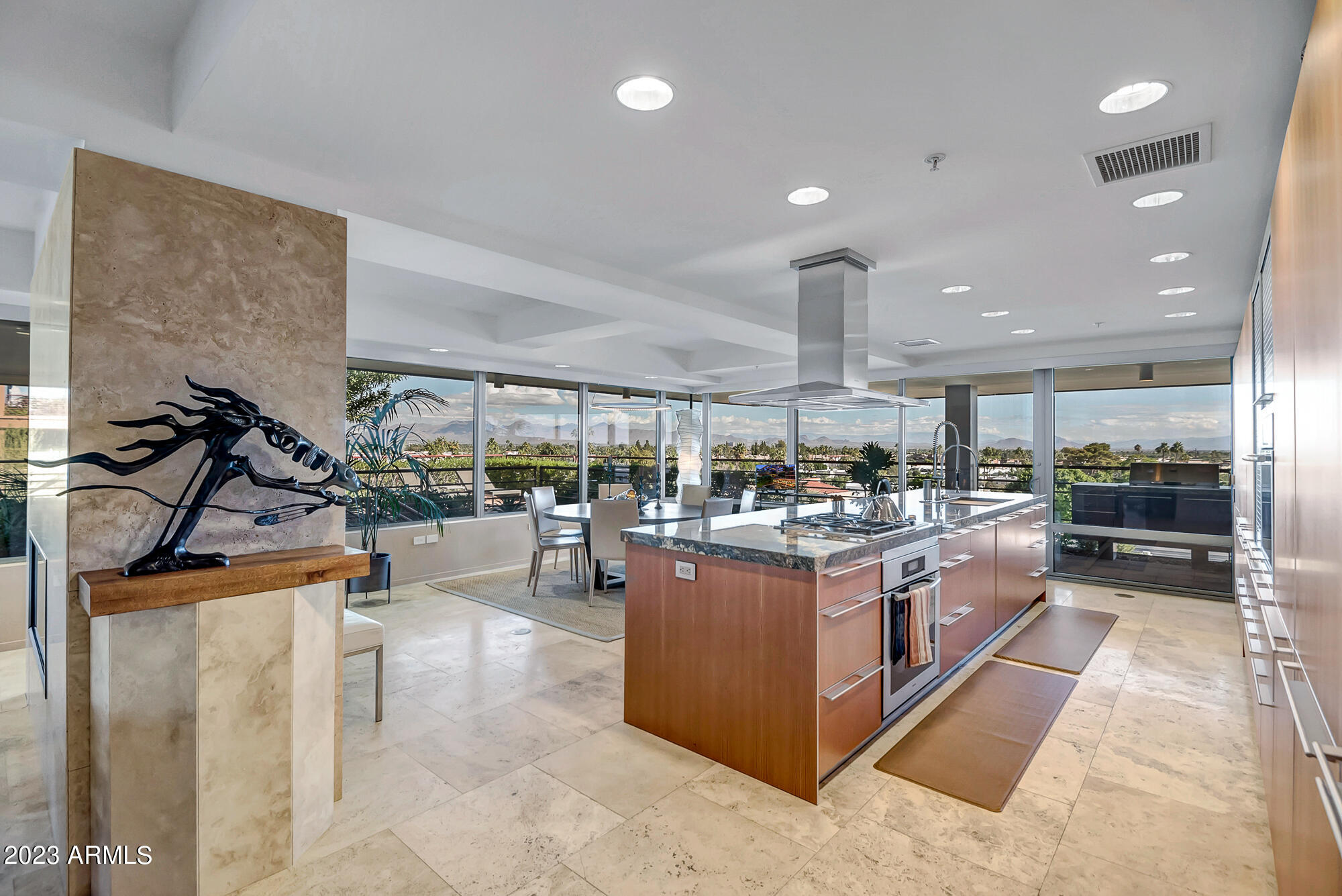 Imagine living in a work of art.  Perhaps the most spectacular unit in the Optima Camelview Village complex is now offered for sale by its original owners.  This unique penthouse boasts 3 bedrooms plus an office/study, 3.5 baths, 3,233 square feet.  There are more than 4,000 feet of patio/gardens with panoramic views of the McDowell Mountains. The developer incorporated all deluxe upgrades and finishes including premium appliances.  The main guest suite is perfectly isolated from the rest of the unit.  The wide open living space has a rare two-way fireplace.  The ''yard'' is comprised of five terraces and extensive indigenous plantings. The award-winning Optima Camelview Village complex is recognized for its dramatic hanging gardens.   Amenities include indoor and outdoor heated pools and spas.  The 24,000 square foot fitness center incorporates all amenities expected of a world-class facility.  Amenities include: Two Outdoor Zen Pools, Spas & Bbqs
One on each side of the community (heated year round). 24,000 sq. ft. Fitness Center (Recently Remodeled). Mens & Women's Locker Rooms w/ Steam Rooms, Showers and Private Lockers. Indoor Lap Pool & 2 Spas (Heated year round), On-site concierge, Putting green, Hybrid Basketball / Pickle-ball Court, Racquet ball court, On-site restaurant (metropolis), conference room, 24/7 Security, Reservable party room and multi-purpose fitness/yoga room.