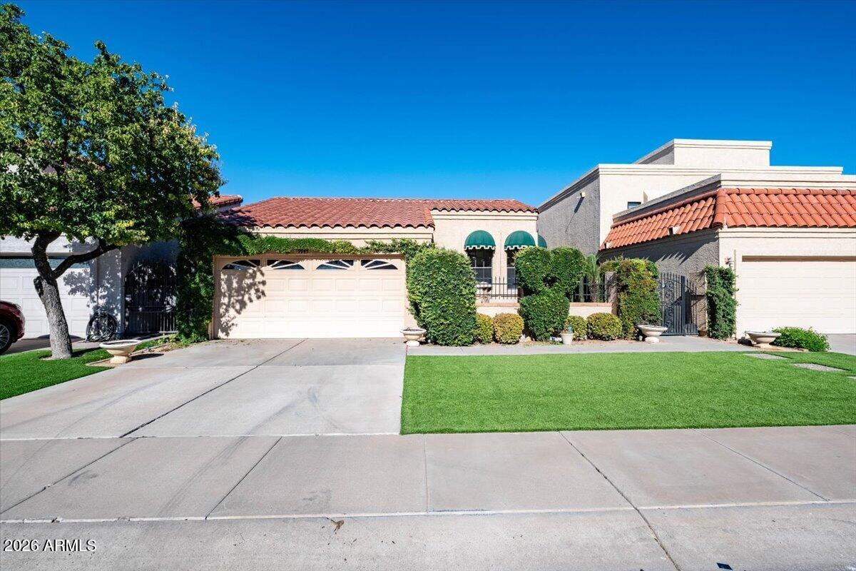 Wonderful patio home in McCormick Ranch awaits your personal touches and renovations. Located in the Casas Dia Festivo community, this home is around the corner walking distance to association pool/spa, sport court and clubhouse. A flexible and spacious 2 bedroom split floor plan with bonus room offer flexible living configuration with formal dining room and oversized living area. Primary suite has a separate tub and shower, walk in closet and dual vanities. Manicured mature landscaping is low maintenance shrubbery with artificial turf  covering most areas. Rear covered patio offers privacy to relax in the shade. This home has been lightly used and lovingly maintained. Additional loft area offers spacious storage inside the home.