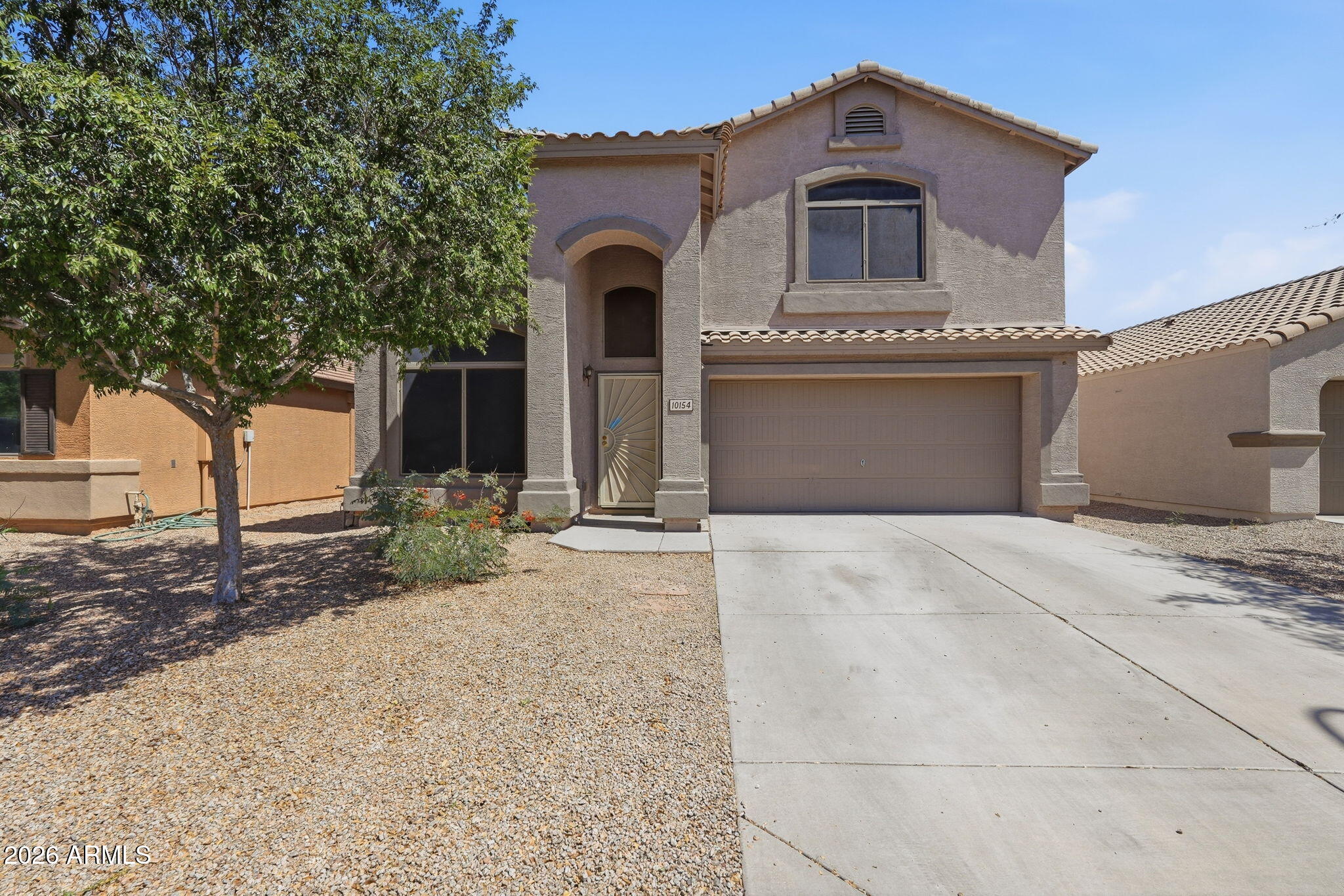 Bright, spacious, and designed for entertaining, this beautiful two-story home offers plenty of room for gatherings both inside and out. Conveniently located near excellent shopping, dining, and entertainment, including Estrella Town Center, this home combines comfort with convenience. The expansive backyard features low-maintenance artificial grass, pavers, and a covered porch, creating the perfect setting for relaxing evenings, family gatherings, or weekend entertaining. With generous living spaces and a functional layout, this home is ready to fit a variety of lifestyles. Solar Panels will be paid by seller!!