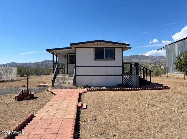 Clean and comfortable home on a beautiful open lot almost half an acre! Great views and setup for easy move in. Can be sold with main 2 bedroom/ 2 bath home private pool for a combined of an acre total. $475,00 for both homes, each with their own power, separate well and septic. Large wash behind the home allows tons of distance between neighbors and beautiful sunsets! Lots of space on the property for more features. Easy access to i17, close to Anthem and Carefree. Can be left fully furnished