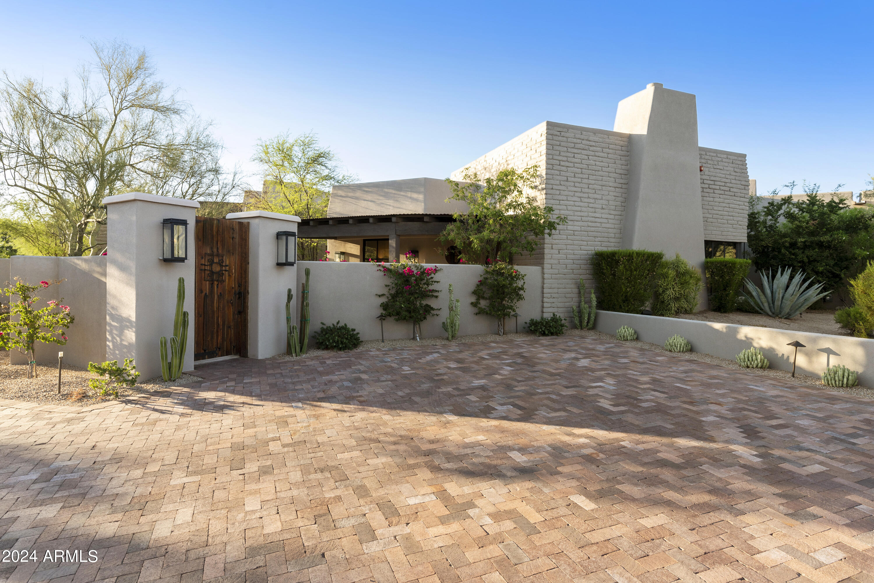 This gorgeous home featured in LUXE Interiors Magazine, was designed by a nationally recognized designer in the highly desirable Desert Highlands Golf & Country Club!  Immediate golf membership when you close at one of the top golf courses in AZ.  

This renovation was completed in 2020 and includes luxury features throughout including wide plank white oak floors, quartzite surfaces, black steel doors, Brizo plumbing, a gourmet kitchen with high-end appliances and a hideaway pantry.  There are 2 owner suites, 2 additional guest bedrooms, and 4 wood burning fire places throughout.

Watch the sunset on the travertine patio next to the sparkling pool in this resort style backyard with views of Pinnacle Peak.  

All designer custom furnishings available through a separate bill of sale.