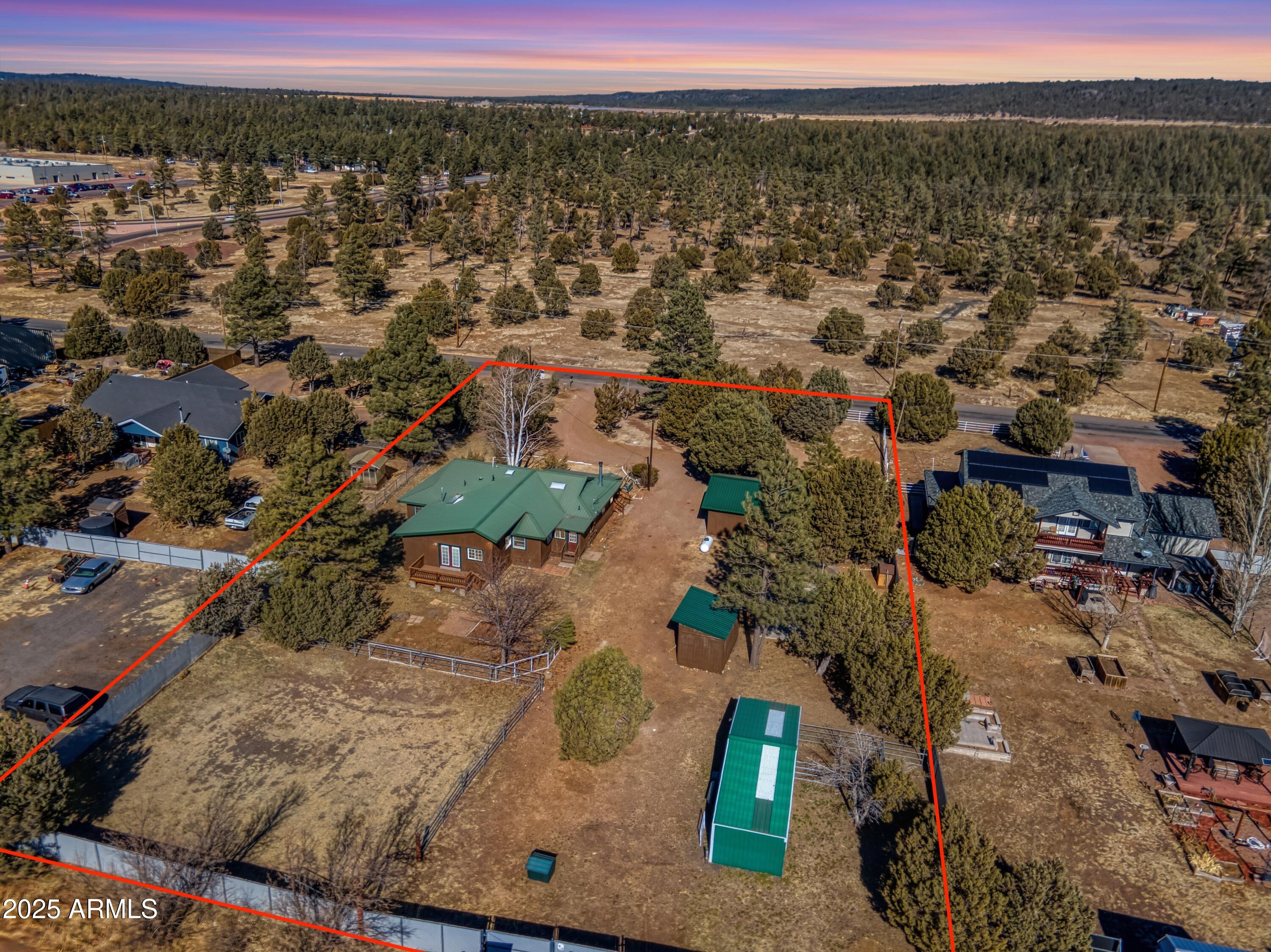 Offering two PRIVATE primary suites in addition to 2 guest bedrooms and guest bathroom! HORSE PROPERTY IN THE HEART OF PINETOP-LAKESIDE! Fully updated home on 1.16 Acres with NO HOA, this is a Rare Find in the mountains! With a 2-STALL HORSE STABLE, fully fenced TURNOUT ARENA, and detached 2-car GARAGE/WORKSHOP w/New Insulation & Drywall this Horse Property is ready for you to Move In Today! Property has a PRIVATE WELL with NEW Pressure Tank and NEW Well House Storage Building. Exterior features privacy fencing and RV PARKING with RV HOOK UP (30amp), WATER HOOK UP, & SEWER DUMP! The home has the Perfect Blend of Modern amenities and Country living. This beautiful property features (but not limited to) NEW LVP FLOORING, NEW CARPET, GRANITE COUNTERTOPS, WOOD-BURNING FIREPLACE, UPDATED CABINETS w/NEW HARDWARE, NEW MODERN LIGHTING, NEW VANITY IN BATHROOM, NEW WATER HEATER, SEALED WEATHER DECKING PORCHES, METAL ROOF, AND ALL APPLIANCES INCLUDED!! Only minutes away from Porter Mountain Stables, the National Forest & beautiful horse/hiking trails!