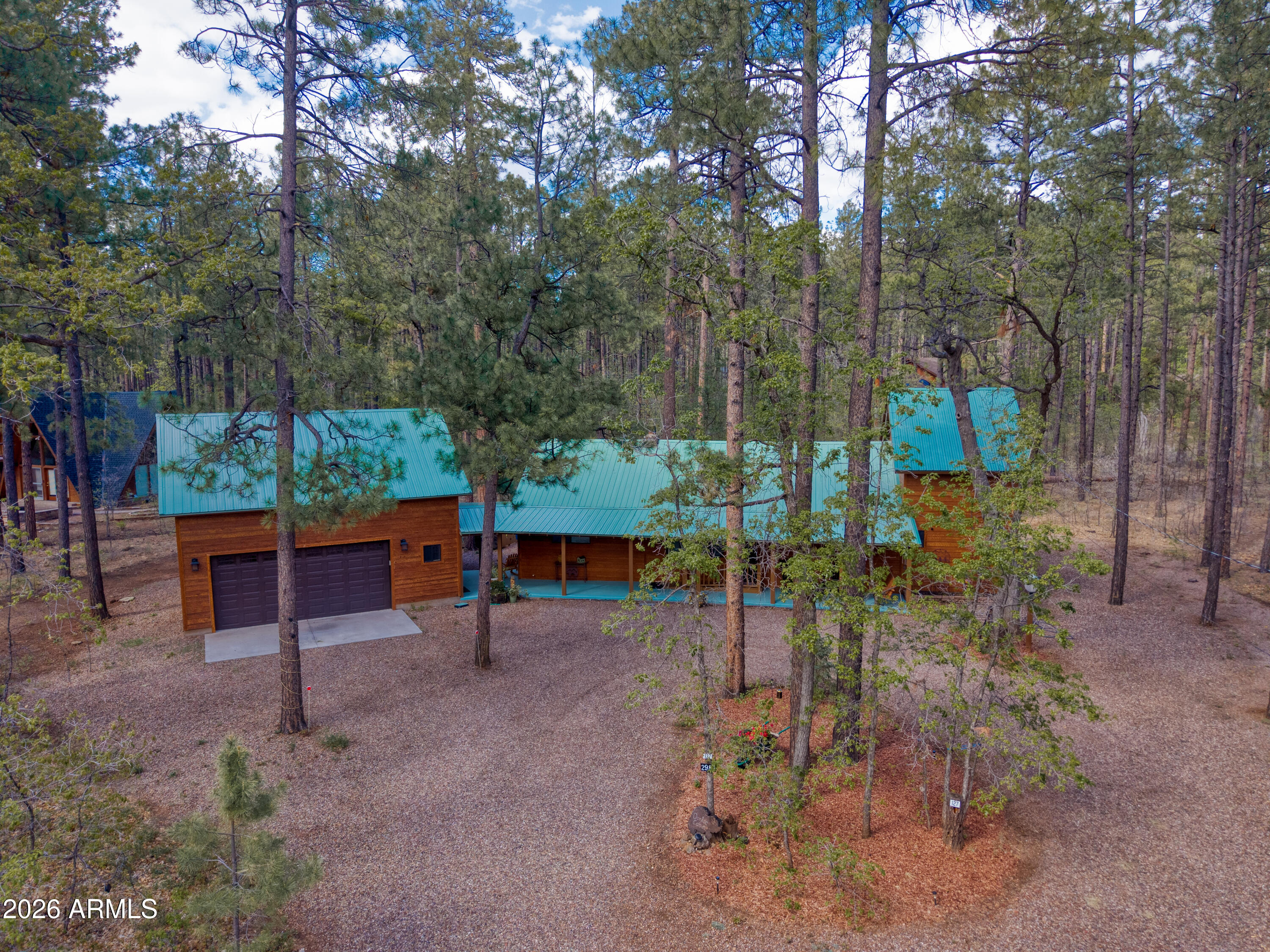 Stunning remodeled in White Mountain Summer Homes. 3 Bed, 2 1/2 Bath, loft, plus bonus room w/ plumbing above 2 car garage. Wood flooring, granite, windows, on .67 acres. Extensive remodel after purchase in 2014. 2 hot water heaters, large 2 car garage. Bonus room above garage is used as artist studio w/ plumbing. Fireplace w/ rock finish in living room  w/ gas log. Inside laundry. Immaculate and move in ready! Buyer to verify square footage.