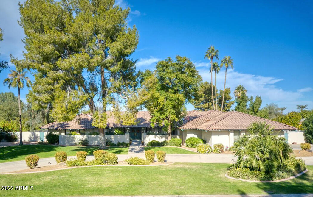Welcome to this wonderful home in Paradise Valley. This bright and spacious home features 4 bedrooms with an office that can easily be converted into a 5th bedroom. Situated on just under an acre of land, no expense was spared on  original remodeled kitchen. The chef's kitchen features SieMatic cherry wood cabinets, 48'' Dacor range with double ovens, two dishwashers, double sinks with granite countertops, and custom lighting. Enjoy the fully equipped wet bar with Sub-Zero wine fridge, double beverage drawers, and Fisher & Paykel stemware dishwasher. The backyard is designed with a vast covered patio, private pool with waterfall feature and peaceful desert views from the gazebo with the fireplace. Located in the Scottsdale unified school district with admission to the ''3 C'' schools