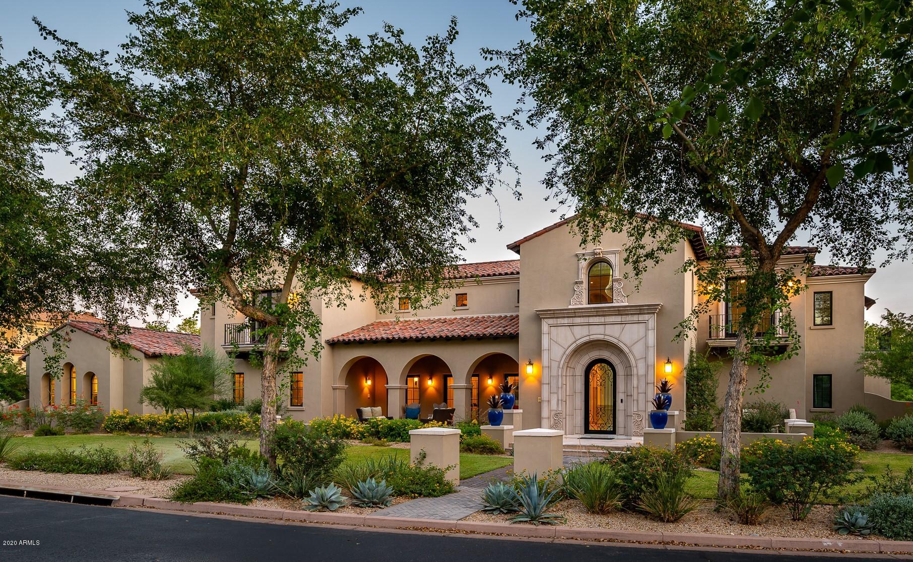 Recently built stunning transitional home with Spanish colonial styling with modern influence in Arcadia at Silverleaf.  This very well-maintained residence offers privacy, function, and the best of Arizona living.  Interior finishes offer a light and bright neutral palette, with clean textures of stone and wood throughout.  Large rooms, soaring beamed ceilings, abundant windows and French doors assure plenty of natural light and deliver a bright open feel. The estate prominently features a large front covered patio and expansive covered rear patios for entertaining and enjoying indoor/outdoor living.  A sophisticated yet comfortable backyard features a generous grass lawn, lush landscaping, outdoor fireplaces, large pool and spa, all well designed for entertaining friends and family.