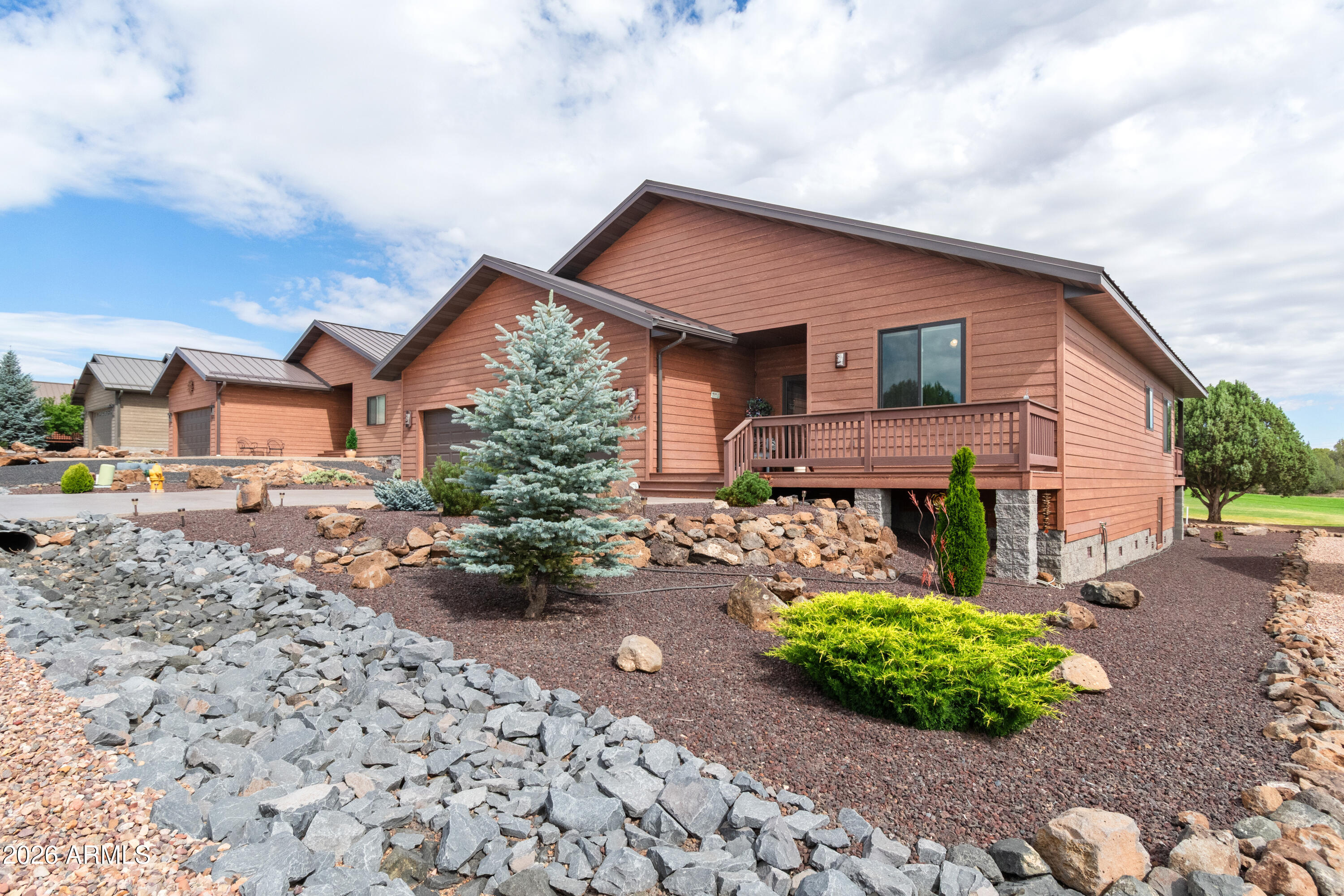 Experience effortless mountain living in this beautifully crafted, 1,903 sq. ft. site-built home perfectly positioned on the fairway in White Mountain Lake Vistas! Designed with quality and comfort in mind, this 3 bedroom 2 bathroom home features a built in office space, oversized utility room, and an attached 3-car garage, providing plenty of room for work, storage and hobbies.

The open-concept great room connects the kitchen, dining and living areas, providing the perfect space for entertaining or spending time with loved ones. Specially upgraded Anderson Windows retain heat and cooling for the perfect climate. The thoughtfully designed kitchen boasts a large island with pendant lighting, beautifully finished cabinetry, modern appliances and conveniently installed electrical outlets above the cabinets for decorative lighting and displays. Luxury vinyl planking flows throughout the home, enhancing the bright, spacious feel.

The primary suite is complete with double vanities and a fully tiled walk-in shower for convenience and comfort. Step outside to the covered deck overlooking the fairway with bright green, luscious grass, where you can relax and enjoy the peaceful golf course setting.

As a resident of White Mountain Lakes Vistas, you'll enjoy access to the outstanding amenities at Juniper Ridge, including the golf course, clubhouse, fitness center, swimming pool, concerts, shuffle board, billiards, card games and a full calendar of community activities. Combining resort-style amenities with affordable mountain living, this exceptional home offers the perfect blend of comfort, recreation and convenience. Don't miss this opportunity to see your perfect mountain home today!