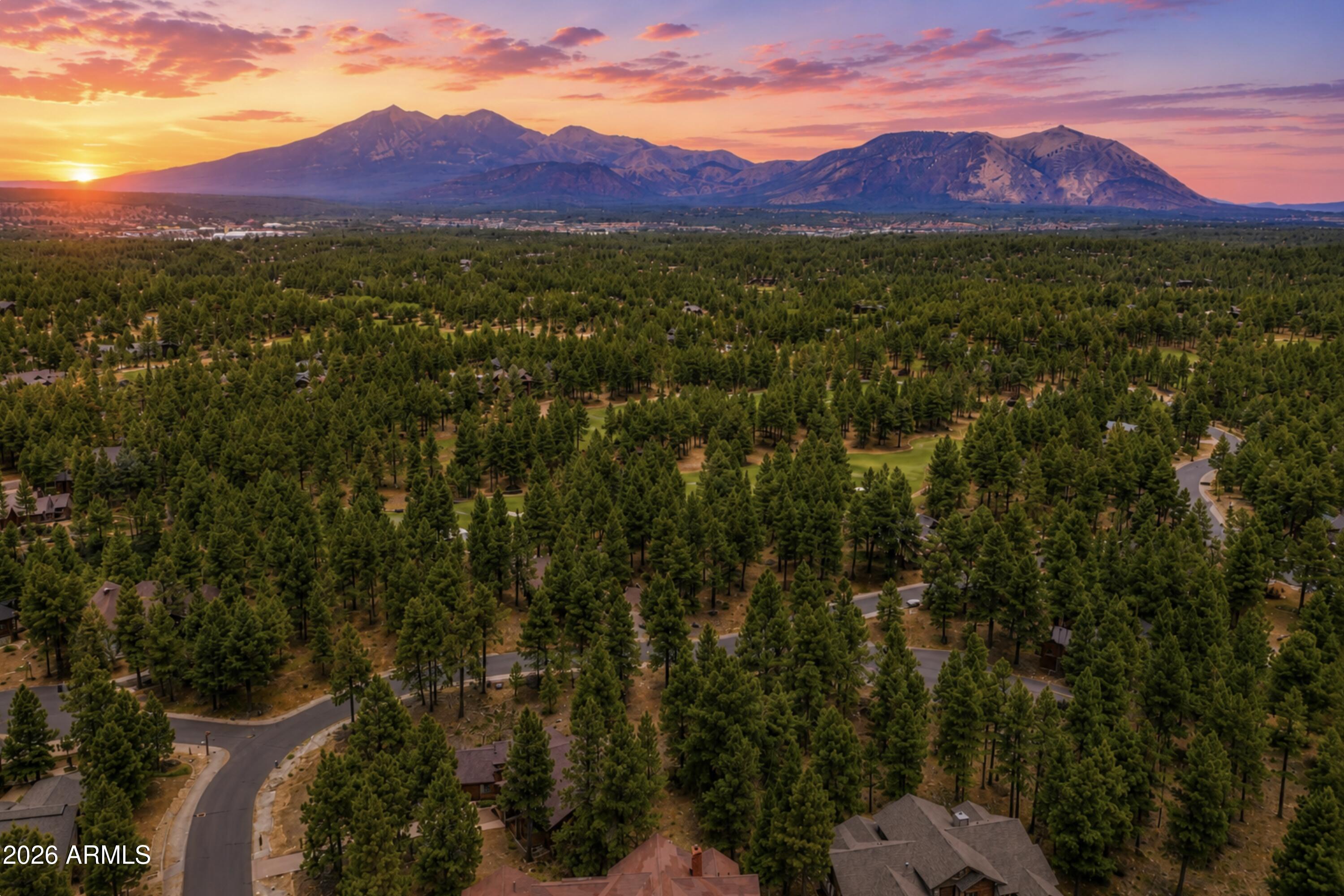 PINE CANYON | 1/2-ACRE HOMESITE | NEAR THE GOLF COURSE |TOWERING PINES

An opportunity to own approximately half an acre in Pine Canyon, one of Flagstaff's most sought-after private golf communities. Surrounded by towering pine trees and positioned near the golf course, this residential homesite offers a compelling setting for a custom mountain retreat. City water and sewer add convenience for future development. Pine Canyon offers an extensive collection of amenities, including golf, pickleball, fitness facilities, a community pool, clubhouse, and more. Whether you're ready to build or looking to secure land with long-term potential, this property offers a foothold in one of Northern Arizona's premier mountain communities. Walk the lot, experience the setting, and imagine what's possibl