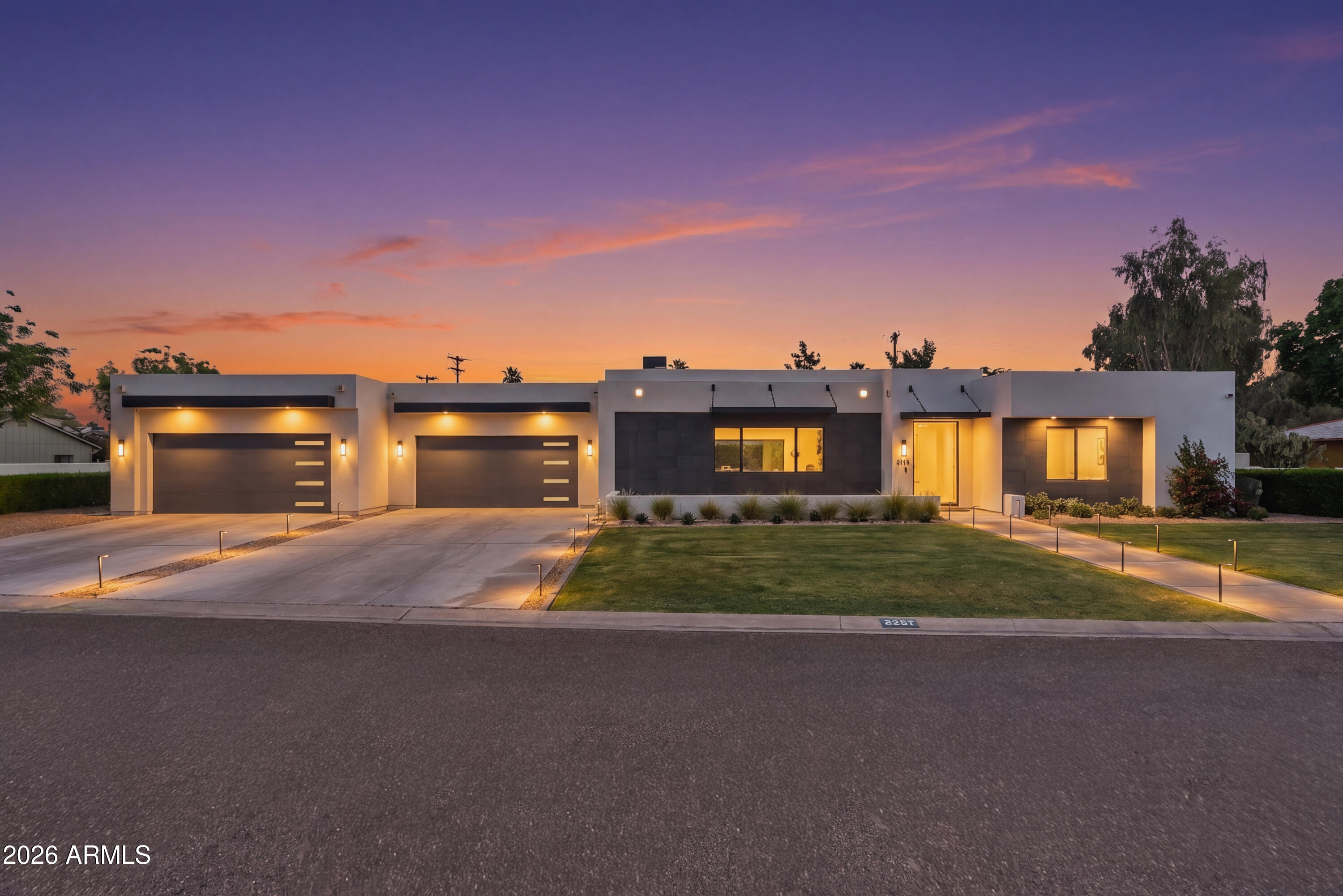 Walking distance to LGO, Postino, Ingo's and other Arcadia favorites, this stunning contemporary Arcadia estate sits on over a half-acre lot and offers a rare blend of luxury, convenience and resort-style living. This spacious 4,670 square foot floor plan is anchored by the heart of the home, featuring great natural lighting throughout the fully equipped chef's kitchen with a new double oven, 6 burner gas stove, pot filler, Scotsman ice maker, dual dishwashers, oversized island, and a prep kitchen with a sink and easy access to the oversized 4 car garage. The dining area includes a custom glass wine cellar right off the main living area, with collapsible sliding glass doors leading to the spacious outdoor living space allowing for the ultimate indoor outdoor living experience.. The 5 oversized, en-suite bedrooms all include custom built out closet systems for optimal storage. The primary bedroom is more like a retreat, with a fireplace, french doors to the backyard, it's large soaking tub, shower with dual fixtures and dual vanity, spacious  custom closet leading directly into the laundry area with plenty of storage and two access points. The backyard oasis offers all the entertainment you could need, with a pickleball & sports court, swimming pool & spa, lush low maintenance landscaping, an outdoor kitchen, fireplace, shower & plenty of covered living space. With whole home water filtration & many upgrades throughout, this one truly has it all, offering a rare walkable lifestyle on a large beautiful lot. Reach out to see it in person!