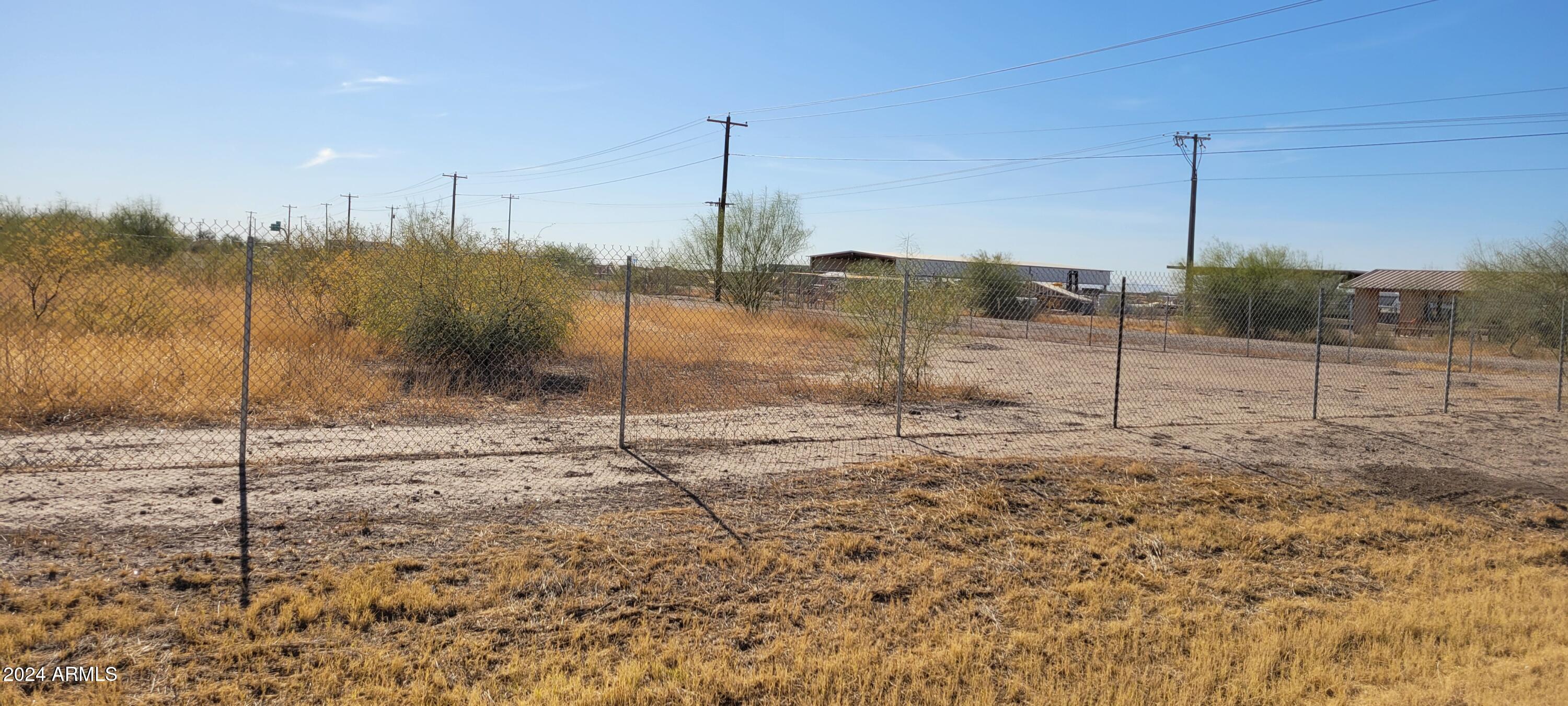 Rare find Light industrial lot with Dual frontage and fully fenced and next to paved road. All utilities including natural gas at the lot and ready to go for your operation. Easy access to Interstate 10 and in close proximity to Interstate 8. Approx. one mile to Railroad. Property is next to the truss manufacturing facility.  This is priced to sell ! Hurry on this one !!