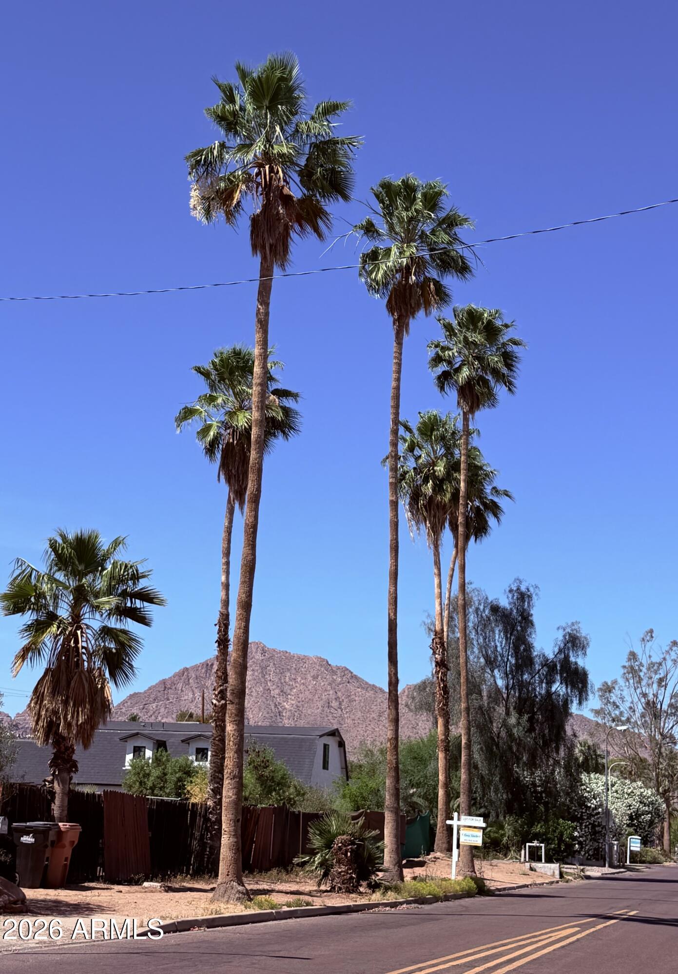 Rare available lot! Build your dream home with Camelback views or take advantage of the investment opportunity near upscale coveted historic Arizona Country Club and Arcadia communities! Over quarter acre lot ready to build with architectural plans for a over 4,000SF home including a soil report and survey. Pick your finishes. NO HOA! Irrigation rights. Love it or List it for profit. The neighborhood supports over $2M homes.