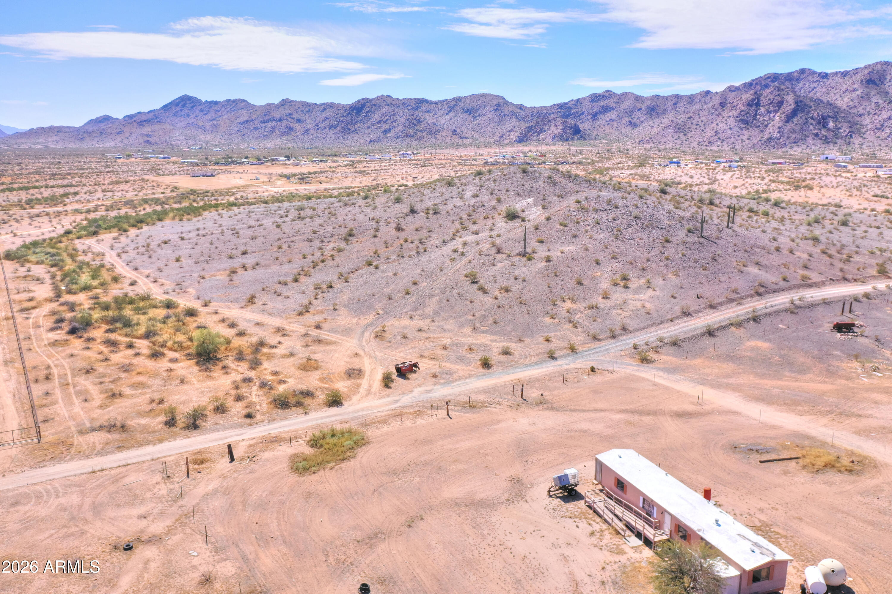 Nearly 10-acre elevated parcel in Maricopa offering expansive mountain views and natural desert surroundings. Property sits on a hill, providing added privacy, open sightlines, and multiple potential building sites.

Located within close proximity to the City of Maricopa for convenient access to shopping, dining, and services, while still maintaining a rural feel.

Ideal for a custom home, ranch setup, or future investment. No HOA allows flexibility for animals, RVs, equipment, and additional structures.