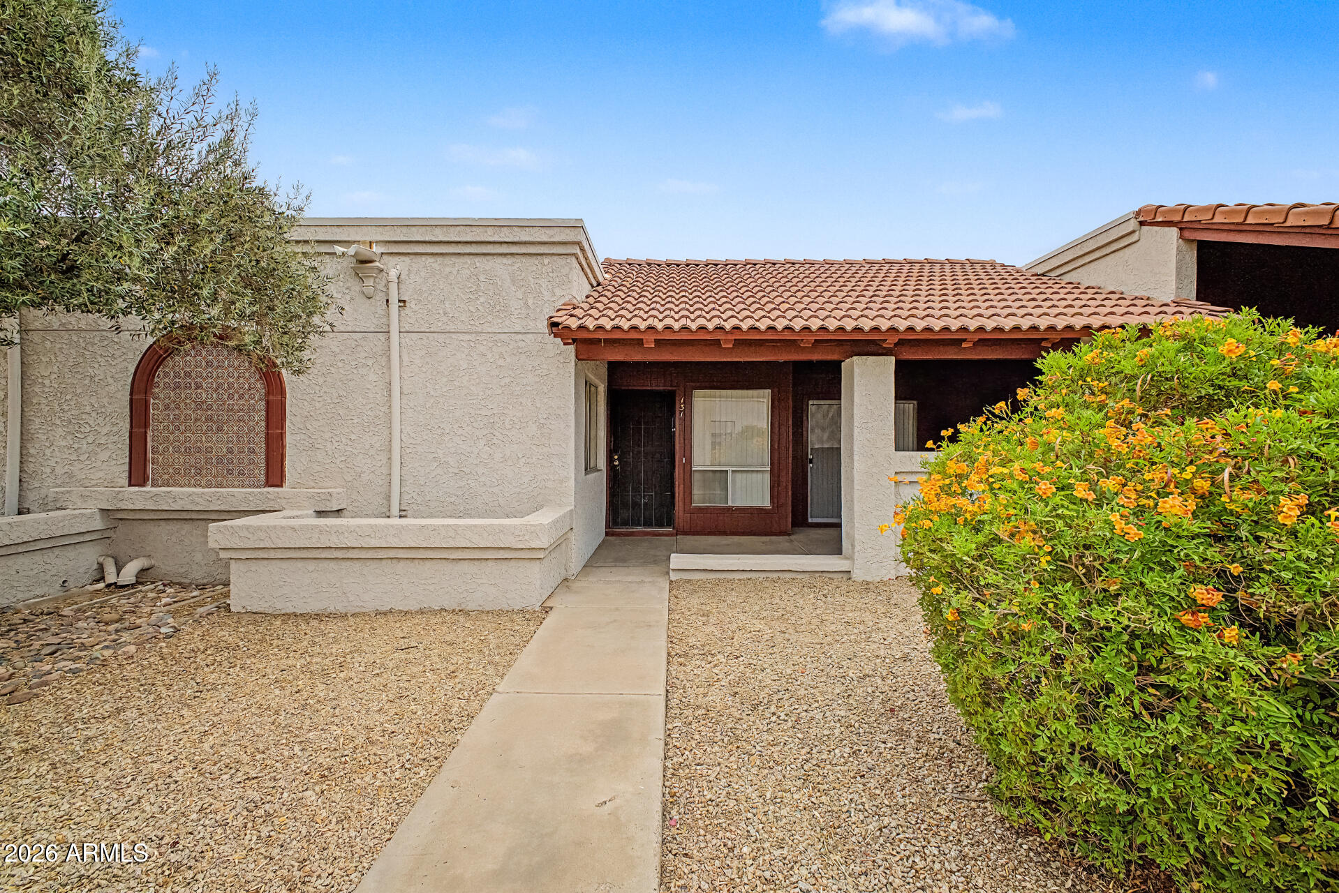 Welcome to this charming townhome in the gated Community Country Meadows! With 2 beds & 2 baths, it tastefully blends comfort and convenience. New Dishwasher and newer stove. Enter to find the inviting living space, perfect for receiving guests! The eat-in kitchen boasts built-in appliances,  cabinetry for ample storage. The main bedroom has a private bathroom for added comfort. If you want to relax, the covered patio awaits you! Let's not forget the assigned covered parking space. Washer and Dryer included!This Glendale location is all about accessibility! Close to schools, shopping, restaurants, entertainment, freeways, & outdoor activities. Don't miss this opportunity!