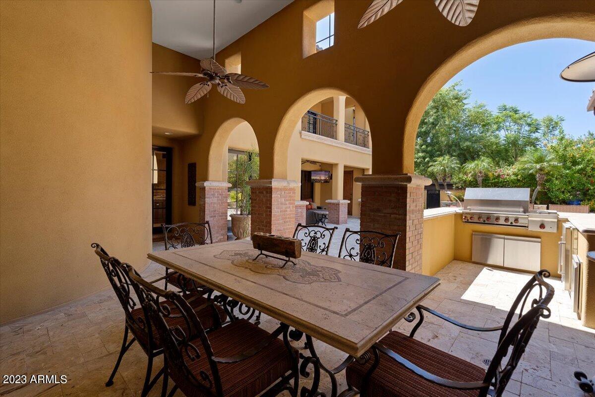 Simply the best price for a truly extraordinary Mediterranean estate in Silverleaf. Warm interior with old world finishes, custom details throughout. Cross the threshold into the elegant foyer with expansive wood beam detail and custom wood finishes. Feel the warmth of this exquisite home. Enjoy the immense chef's kitchen yourself or impress large gatherings. Top-of-the-line appliances throughout. Primary suite and executive office on main level. For privacy, guests may use a separate exterior entrance to reach the 4 upper level guest suites, and one includes a kitchenette for pampered luxury. Expansive loft on upper level for multiple uses: media, play or study. Prospect Park steps out the front door expand the livability of this special home. Three car garage with large walk-in storag Primary suite is a luscious retreat with hardwood flooring, custom window treatments, separate walk in closets, separate toilet rooms, a sitting area with fireplace and private patio. The opulent bath features dual sinks, separate tub and dual shower heads in the walk in shower. Alongside the primary retreat is an office, and  right outside you'll find lush landscaping all around while relaxing in your private patio.
The four bedrooms upstairs each offer their own baths, all with custom details, and walk in closets. 
Included in the sale are all bar stools inside and out, patio furniture consisting of sofa and dining table and chairs.
All other furnishings available separate bill of sale. Move in ready, just bring your personal items! Quick close also available.