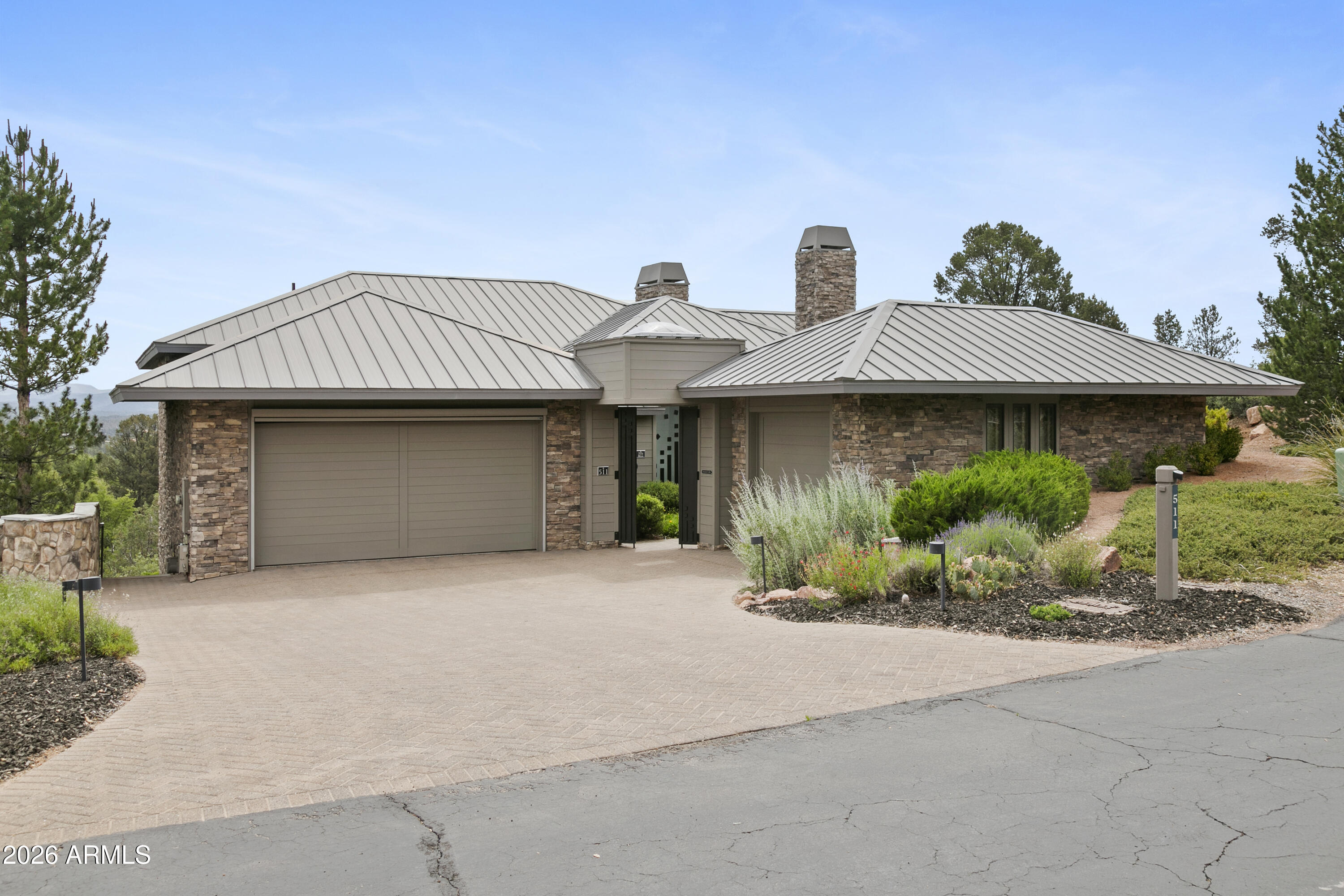 Rare opportunity to buy a custom-built, one-owner contemporary home with one of the best views in Chaparral Pines. The owner-designed front gate and entry pivot door set the tone for the delights ahead.  From a hillside perch, there is a 26 mile view of the Mogollon Rim, Diamond Point, and the Mazatzals from the deck accessed with telescoping slider doors bringing the outside to the inside.  Pergola and stone water feature add to the charm of the Trex deck. Gourmet kitchen with Wok burner and two sinks opens to great room with soaring 14 foot ceiling.  Private elevator provides easy access to lower level.  Modern accents throughout including drop down art over television, powder room with fabricated metal accents on floor and ascending to the ceiling.  Spacious master metal art surrounding fireplace in master bedroom.  Toto toilets throughout with bidet option in master bedroom.  Custom wine room added four years ago has capacity for 400 bottles.  Separate dry bar for guests has microwave, wine cooler, and sitting area. There is nothing ordinary about this home.