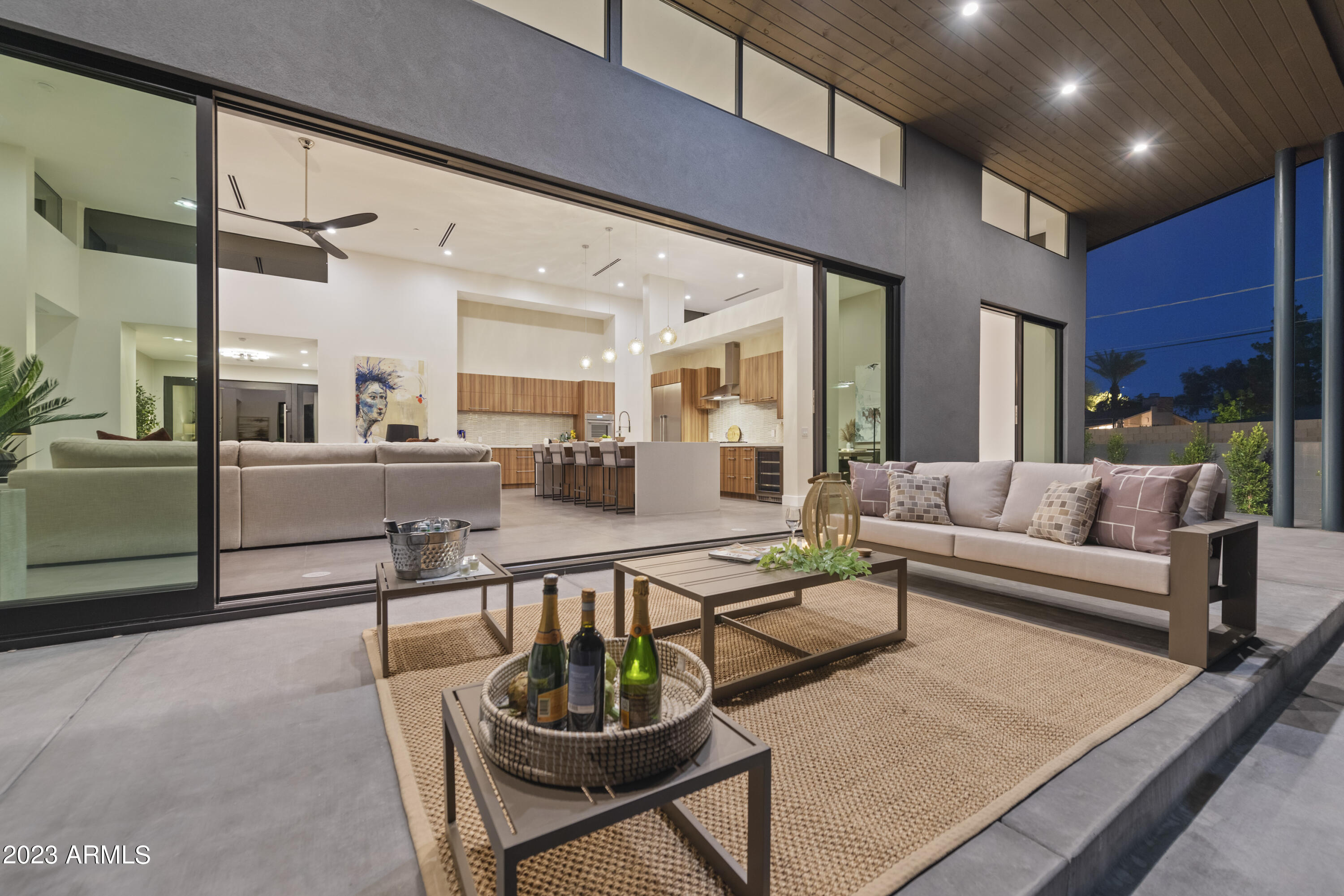 Introducing an awe-inspiring masterpiece of contemporary architecture in the heart of Scottsdale. This brand new home has been meticulously designed to offer the ultimate in luxury and style, with every detail carefully considered to create a truly remarkable living experience.
As you approach the property, you'll be struck by the clean, sleek lines of the home's exterior. Inside, the open-plan living space is flooded with natural light through the walls of glass, creating an inviting and warm atmosphere. The gourmet kitchen is a chef's dream, with top-of-the-line Thermador appliances, sleek cabinetry, and ample counter space for preparing meals and entertaining guests.
The spacious master suite offers a peaceful retreat from the hustle and bustle of daily life, with a spa-like bathroom featuring a soaking tub and walk-in shower. Additional bedrooms located around the additional living room are generously sized and offer plenty of space for guests or family members. This stunning contemporary home is located in the highly sought-after Scottsdale area and Arcadia, offering access to world-class dining, shopping, and outdoor activities. Don't miss your chance to own this one-of-a-kind architectural masterpiece.
