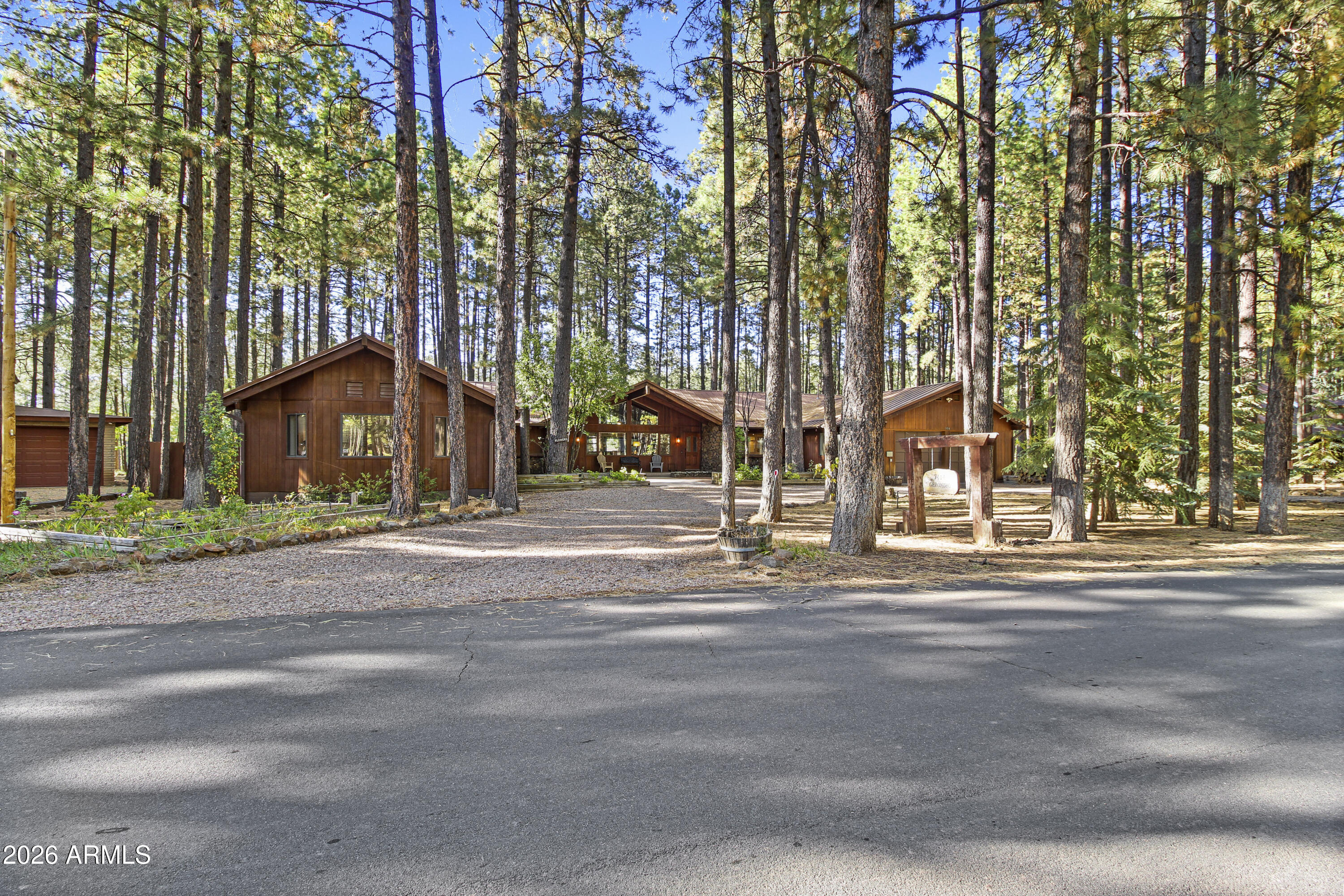 Beautiful REMODELED Ranch on the 17th Fairway of Pinetop Country Club.This 5 bedroom, 4 Beth home offers views of the fairway from your covered patio or hot tub.  Recently Remodeled in 2024, new flooring, walnut cabinets, kitchen has quartzite stone counters, builtin microwave with oven, air fryer, etc., LVP throughout home.  Energy efficient windows on the golf course side of home.  Separate Guest Qtrs with separate entrance.  Guest Qtrs feature large great room, large bedroom with King bed and bunk beds, bathroom and kitchenette with mini split for heat and A/C. Main house has vaulted T&G ceiling in Great room and master bedroom, split floorpan, 2 wood fireplaces, new showers, 2 laundry rooms, and a large 2 car garage. Beautiful views in the cool mountain air.