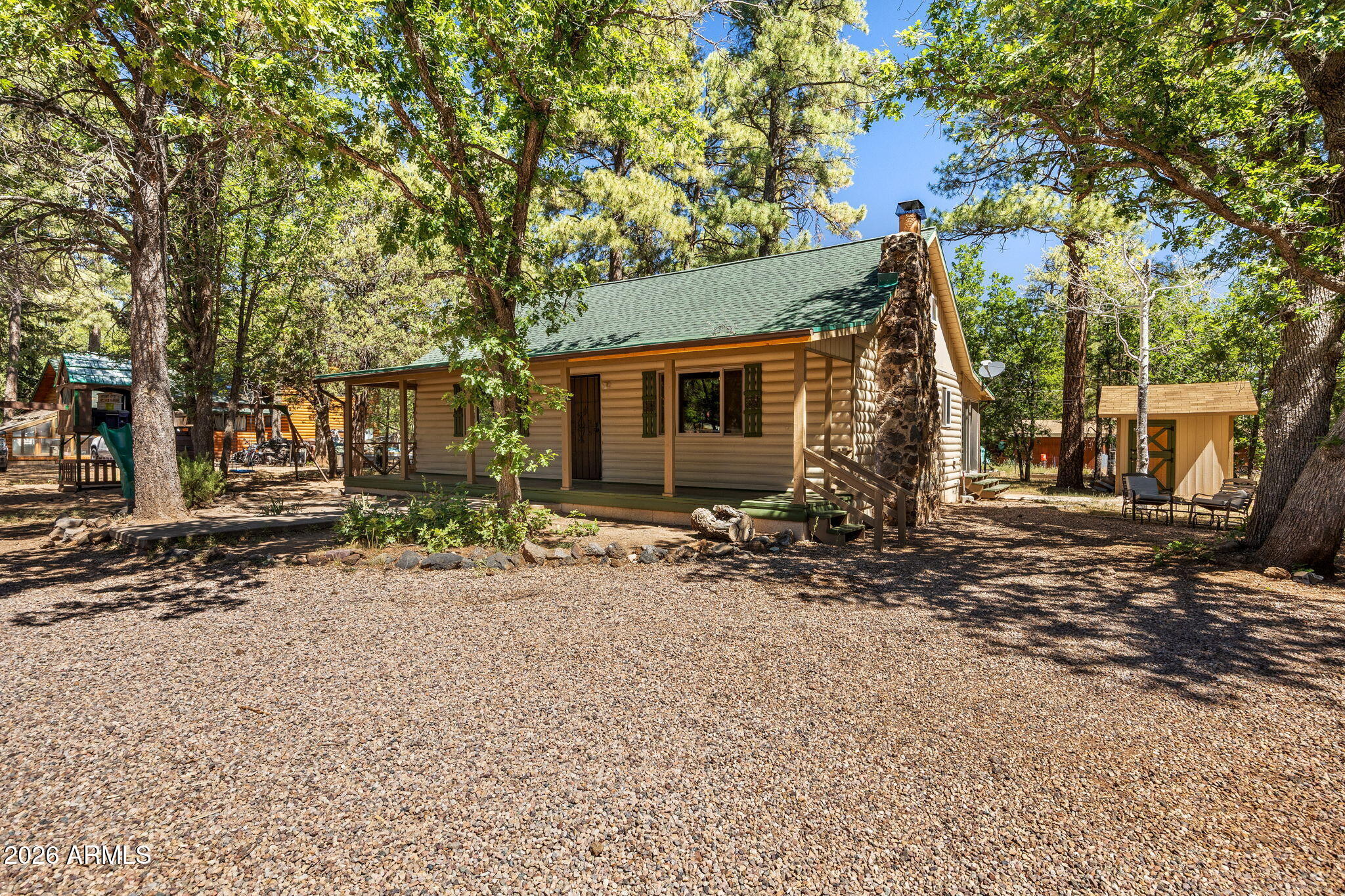 Looking for a cabin in the tall pines of the White Mountains? Here it is! This charming 1959 cabin is on a fully fenced .43 acre lot. All solid wood interior walls, ceiling, floors and cabinets. Vaulted ceilings. Cozy fireplace in living room. Two bedrooms one full bath downstairs. One bedrooms one full bath upstairs plus a loft room that could be an additional bedroom. Bonus AZ room of the back of the house. Large covered front deck to enjoy the four seasons. New roof and exterior paint 2025. Two car oversized detached garage. Located in the heart of Lakeside AZ close to everything, Movie theater, restaurants, hiking trails, lakes, Sunrise Ski resort. NO HOA would make a great short term rental!
