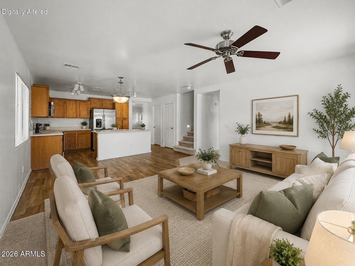 Welcome to Agua Fria Ranch, where this charming two-story home awaits you! Offering 4 beds, 2 baths + powder room, 2-car garage, and a NEW ROOF. The interior features tons of natural light, a neutral palette, and carpet & wood-look flooring throughout. Discover a combined living & dining room with a stone accent wall, alongside an inviting family room that opens to the kitchen! SS appliances, ample wood cabinetry, a pantry, track lighting, and an island w/breakfast bar make up the culinary space. All bedrooms await upstairs, along with a versatile loft! The large main bedroom has a walk-in closet and a full bathroom. The spacious backyard provides a covered patio! With your creative ideas, you can make it a complete outdoor oasis. Excellent location! Don't miss this opportunity!