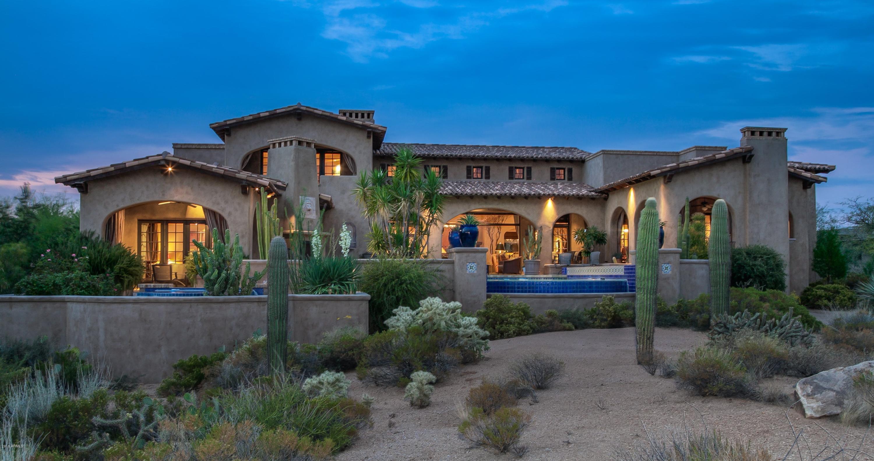 SPECTACULAR BING HU Spanish Colonial home on one of the best premium golf course lots in Mirabel! Mountain Views, City Lights and Sunsets! Attached 2 room guest casita with living room, fireplace, kitchenette, bedroom and separate entrance. Quality finishes throughout this custom home. All primary living spaces are on the main level with one en suite bedroom on the upper level for total privacy. The home features 4 bedrooms plus a den/office, a great room with fabulous southern views, a true gourmet kitchen, an outdoor patio with covered dining and living areas, negative edge pool and spa. Wine cellar, 7 fireplaces throughout. A true masterpiece in Mirabel Club.  Don't miss this one!