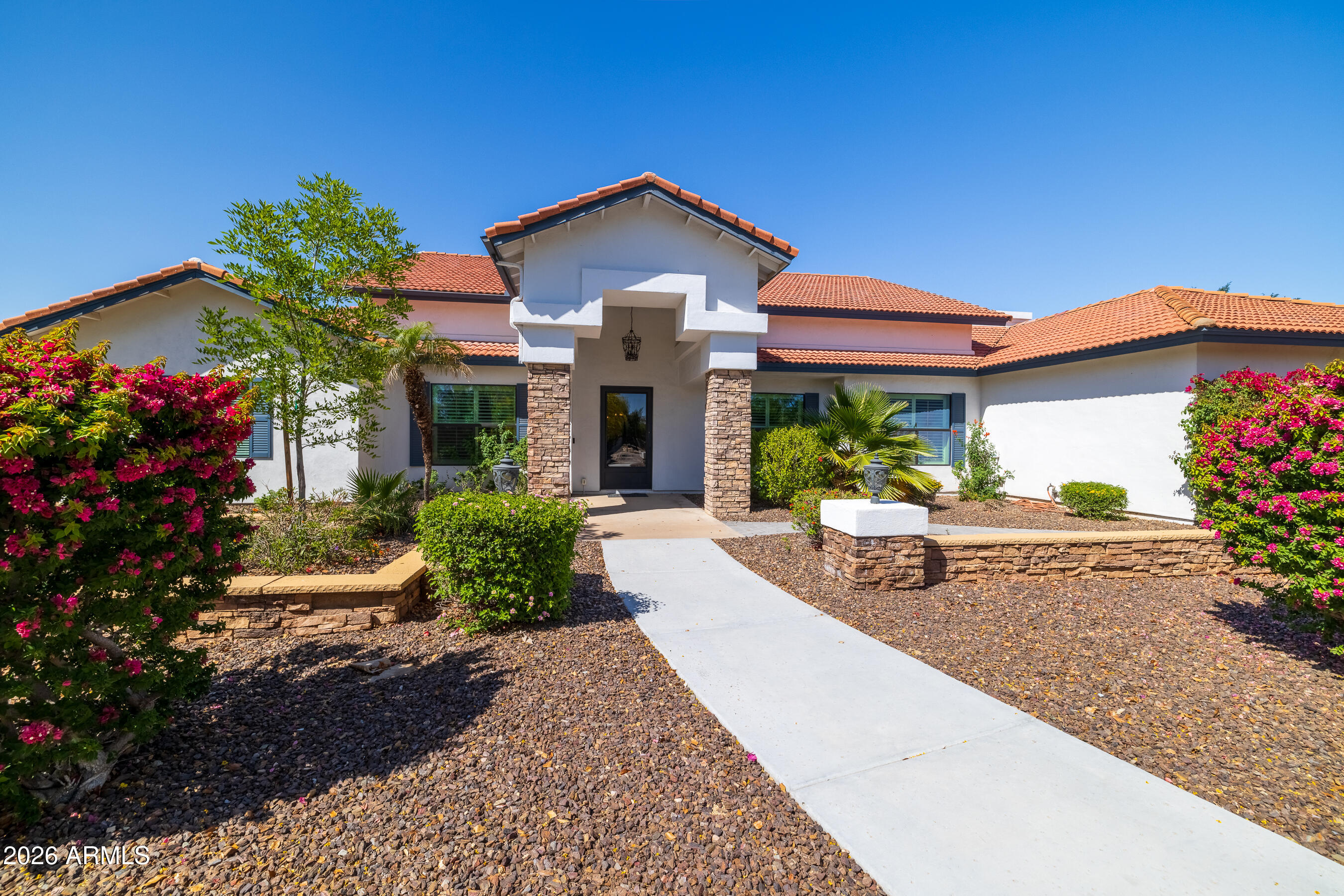 Properties like this don't come on the market everyday. This stunning 5 bedroom, 4 bath home sits on just under an acre. This resort-style home boast beautiful views of the McDowell Mountain peaks, a gorgeous pool and covered sitting area with fireplace for those cool winter nights. For the wine lovers, after you enter a huge pivot glass door, you will be greeted by a custom cellar to store all the delicious bottles of wine. Certainly a statement for your next entertaining event. The list of amenities this home has to offer is amazing, from an energy saving 18kW SunPower solar system (owned outright), 2 fireplaces, 3 car garage w/ epoxy floors, craft shed with power and a/c, Schuco solar water heater & 2 newer efficient HVAC.
