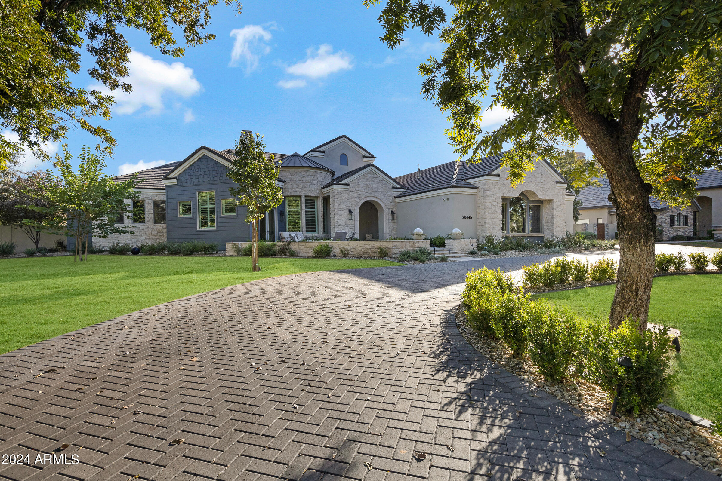 20445 E Sunset Ct, Queen Creek, AZ 85142 - The Pecans' Finest Gem

Step into unparalleled luxury at this 5,737 sqft masterpiece, nestled in The Pecans—a premier, gated community in the East Valley, renowned for its grand estate homes and lush pecan groves. Remodeled by a top-tier custom home builder celebrated for impeccable craftsmanship in Paradise Valley and Arcadia, this residence offers an elevated living experience. This 4-bedroom, 4.5-bath estate is a flawless blend of sophistication and innovation. The heart of the home is its newly reimagined kitchen, a chef's dream with custom in-set cabinetry, Wolf and Subzero appliances, and designer lighting that enhances the airy, neutral palette throughout. Every room exudes refined elegance, and the layout is meticulously crafted to balance open living spaces with private retreats.

The reimagined backyard is a showstopper. The pool was thoughtfully relocated to align with expansive glass sliders in the living room, offering breathtaking views and seamless indoor-outdoor living. The outdoor space now feels like a private resort, complete with modernized landscaping, and luxurious entertainment areas perfect for any gathering.

No detail was overlooked; no expense spared. This is a must-see for discerning buyers looking to own a piece of luxury in one of Queen Creek's most exclusive enclaves.