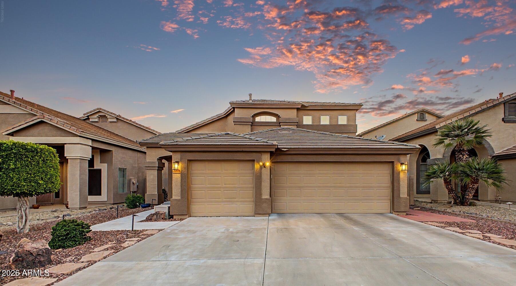 Beautifully updated with excellent curb appeal, this meticulously maintained home is truly turnkey! The stunning kitchen features quartz countertops, stainless steel appliances, and new designer lighting, all complemented by soaring vaulted ceilings and a bright, open layout. Enjoy peace of mind with newer HVAC systems (2020/2021), sunscreens, and abundant storage in the 3-car garage and spacious closets. The flexible floorplan includes a downstairs bedroom with adjacent full bath--ideal for guests or multigenerational living. Step outside to a private backyard oasis with a sparkling pool, water feature, and lush grass area. Immaculate inside and out, this move-in ready home is located near excellent schools. Don't miss this opportunity!
