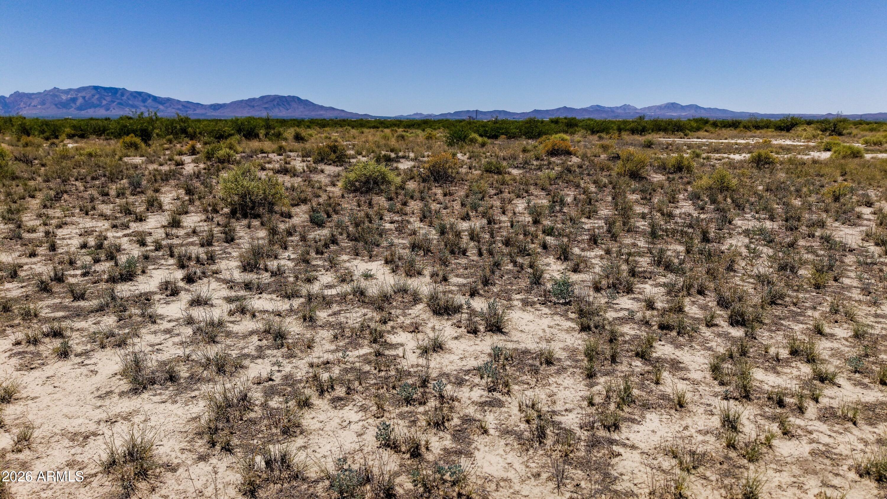 20 ACRES OF PURE ARIZONA FREEDOM -- Cochise County Off-Grid Escape! Wide-open high desert with sweeping Dragoon Mountain views, star-filled skies, and total privacy. Bring your RV, campers, storage containers, or set up a mobile home or two -- this blank canvas is ready for your off-grid vision. Perfect for recreation, weekend basecamp, stargazing getaway, horseback riding, or long-term land banking. Minutes from I-10 between Willcox and Benson, near historic Cochise Stronghold. Sold AS-IS: raw vacant land, NO water, NO electric, NO septic -- Large acreage. Own your piece of the Old West today!