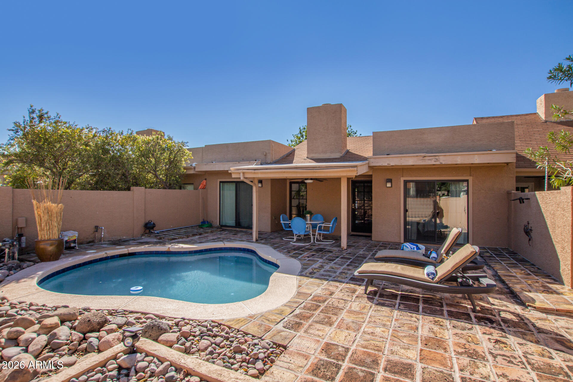 STUNNING, fully remodeled townhouse with a sleek, modern look, offered fully furnished. This 2-bed, 2-ba home features a private plunge pool & breathtaking mountain views in desirable North Scottsdale. Ideally located near premier shopping, dining, & freeway access. Enter a light-filled, vaulted living space with a cozy fireplace. Gourmet kitchen showcases stainless steel appliances, beautiful cabinetry, & a charming dining area with a bay window. Both bathrooms are updated with modern finishes & fixtures, including spacious dual-sink vanities. One with a tiled walk-in shower, while the othe showcases a freestanding soaking tub with a rain showerhead. Enjoy seamless wood-look ceramic tile flooring throughout, a private laundry area, & access to a charming community & two sparkling pools.