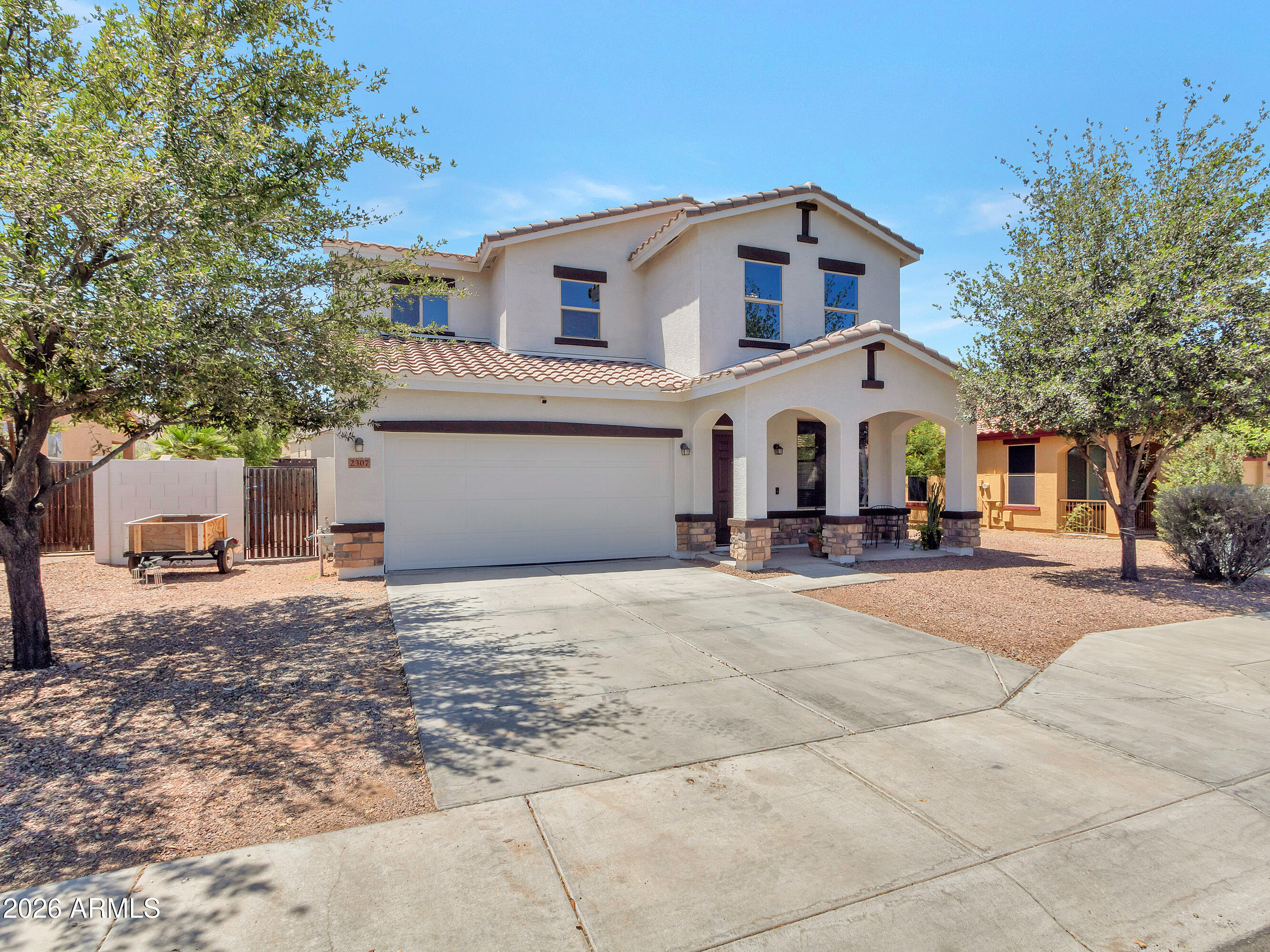 Wake up to South Mountain as part of your everyday view, with quiet mornings, birds singing in the trees, and a backyard made for ease.  This freshly painted home blends flexible interior living with the outdoor leisure.  Spacious kitchen with granite countertops, ample storage & newer Samsung/LG appliances. The main-floor primary suite offers privacy and convenience with a, soaking tub and separate walk-in shower. Upstairs, two additional bedrooms, a full bathroom, and a loft creating a flexible space for work, entertainment or hobbies. Outside, the backyard is the heart of the home, with artificial turf, pergola shade, fire pit, and custom raised edible garden beds. Additional highlights include upgraded long-blade ceiling fans, wood-slat blinds, XL steam washer and dryer.