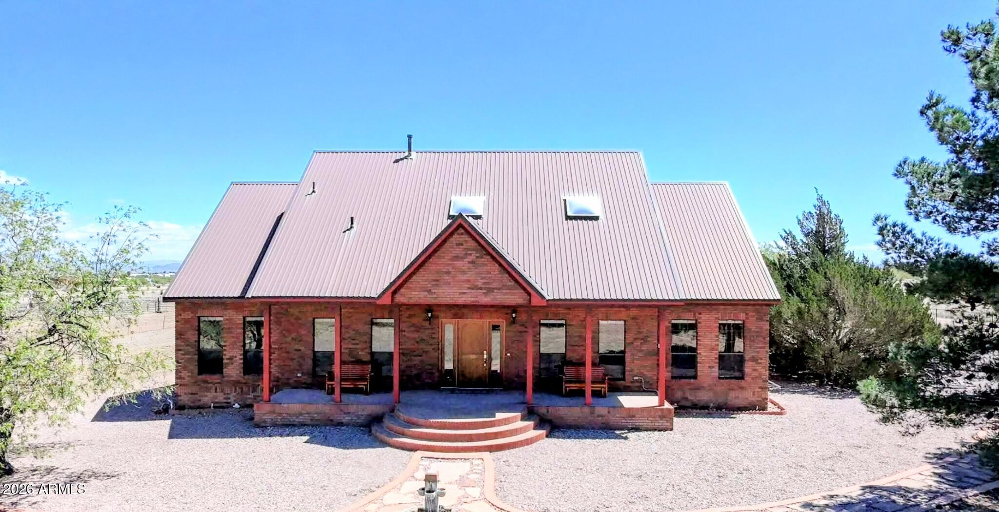 Charming rural property with a STUNNING indoor pool in Pearce, AZ! Come sit on the front porch and watch the sunset. Situated on a spacious lot with wide open skies and mountain views, this beautiful home is clean as a whistle and shows true pride of ownership. Featuring a functional layout with comfortable living spaces and abundant natural light, the property also boasts a gorgeous, updated indoor pool and spa, perfect for year-round enjoyment and entertaining. Equestrian-ready with a large metal barn complete with a tack room and cabinets, plus an RV hookup for added convenience. The property has plenty of space for animals, equipment, or additional structures, and is serviced by a private well. Ideal for those seeking privacy, functionality, and a peaceful lifestyle.