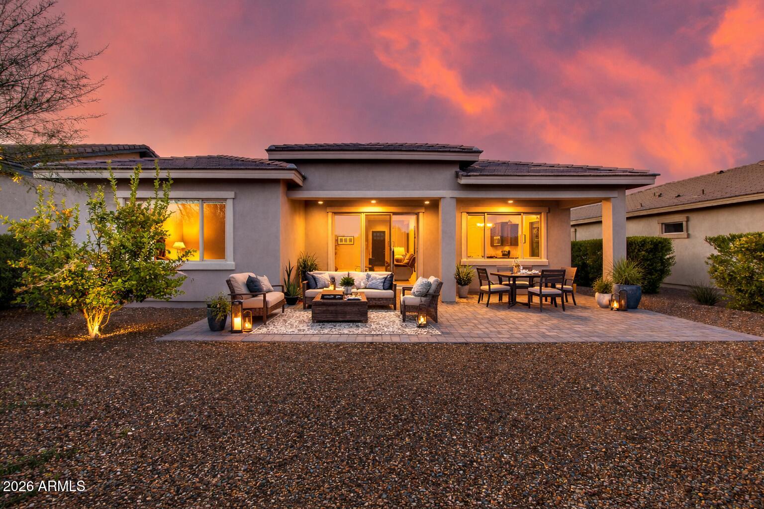 Sweet Caroline floor plan in Wickenburg Ranch--popular 1,800sf w/2BD+2BA+Den & coveted 3-car tandem garage. Award-winning, model-home design (Home Builder Awards in Las Vegas) lives even larger w/10' ceilings, oversized Owner's Suite, walk-in shower & spacious laundry w/extra storage. Upgraded flooring throughout, stylish two-tone paint, abundant cabinetry, & paver driveway. Gorgeous front landscape welcomes you home. Generous outdoor living features large covered patio & backyard waiting to become your private oasis--perfect for sunrise coffee, entertaining, or quiet desert nights. Enjoy east mountain views. Prime location--moments to lake park, catch-&-release pond, short course, restaurant, & scenic walking trails in this exceptional golf-lifestyle community. Rare find--move-in ready!