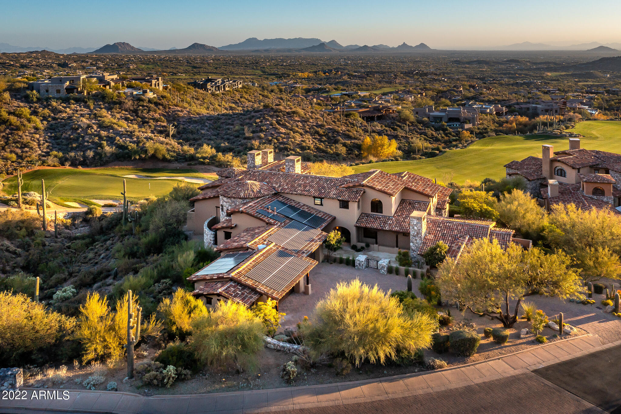 This Signature European home with a Golf Membership available, was sited on one of Desert Mountain's
most picturesque lots providing elevated vistas of the full 18th fairway of the Chiricahua course,
and beyond to vast valley and city light views. The current owners have completely reimagined
and reconstructed the interiors with an organic contemporary flair to be a light-filled, open plan,
achieving single level main living areas redone in wide-plank oak flooring, glass doors and
expanded floor to ceiling windows throughout, and lush new landscaping. The main floor
includes a living room, conversation lounge, inspiring chef's kitchen and pantry, dining and
family room, along with a spacious primary retreat, office and guest suite. Dramatic new fireplaces are the focal points of the living,
family and conversation areas along with one in the
primary suite. The second level, accessed by a dramatic spiral staircase, features a sprawling
junior primary suite, gallery style balcony overlooking the great room, and a quiet reading nook
with an amazing view window. There is a first floor studio-style guest suite with private courtyard
entry and pool access. Patio living features spectacular views, a large pool/spa, covered grill
and dining area and a chaise plaza area for enjoying the magical Arizona outdoors. Other
features include a cloistered wine room, a kitchen herb garden and 4 car garage. The finest

natural stone and wood materials have been incorporated using skilled artisans and state of-
the-art lighting, shades and electronics plus owned solar panels. The price includes an all new furniture package

offering the convenience of a turn-key purchase. Membership to the Desert Mountain Club is by
application and requires a 30 day approval process. Please contact Membership for details.