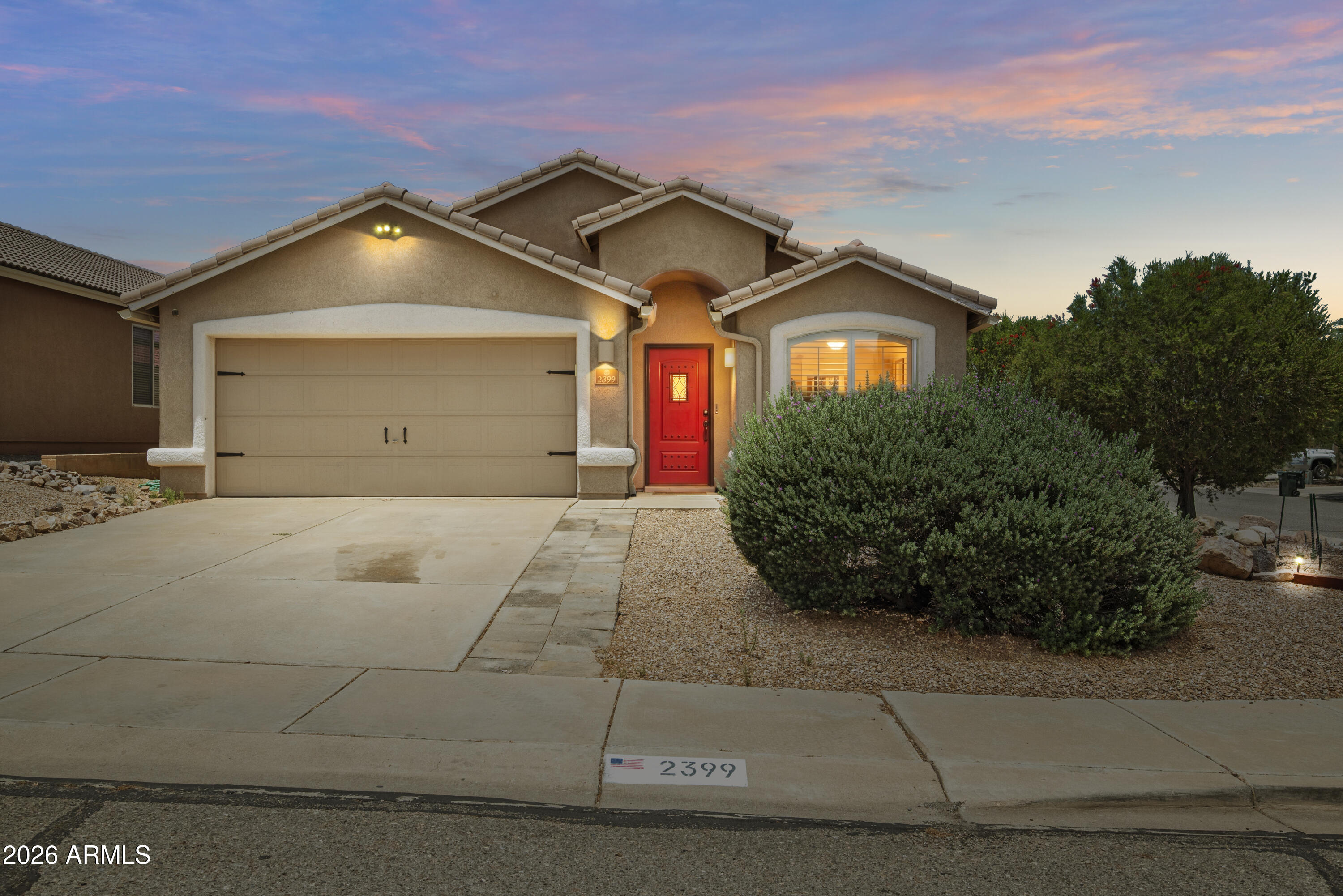 **Owned Solar! Beautifully maintained and move in ready, this 4 bedroom, 2 bathroom home offers 1,906 sq ft of comfortable living on a desirable corner lot. The thoughtfully designed layout features a spacious living area and an updated kitchen with a large island, granite countertops, modern backsplash, ample cabinetry, and stainless steel appliances perfect for entertaining or everyday living. Tile flooring runs throughout the home. The spacious primary suite includes a walk-in shower, relaxing garden tub, and generous closet space. Step outside to enjoy the covered patio, low maintenance turf backyard, and additional outdoor living space ideal for Arizona evenings. Owned solar helps keep utility costs down adds to everyday convenience.