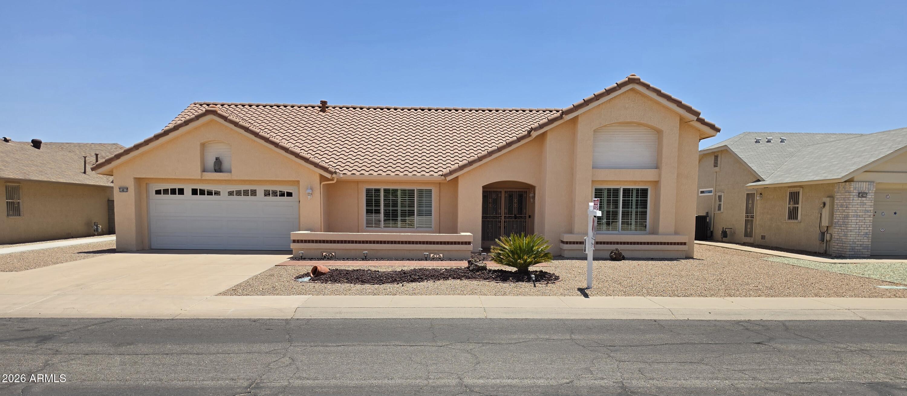 This home has been well-maintained and very much ''Loved'' by original owner. Several recent updates, include roof replaced within the last ten years.  Enjoy a full suite of newer kitchen appliances: raised panel cabinets, pantry and Quartz countertops.  Flooring updated 2019.  Both AC unites were replaced in 2020. The interior displays notable architectural detail, beginning with an inviting arched entryway, with soaring ceilings in primary rooms of the home, making the home ''live large''! The family room leads into a large, heated/cooled room addition of (512 SF) permitted Arizona room featuring tile flooring as well as an extra insulated roof.  Pella Windows through-out installed 6/09.   Wood Shutters Through-out. 2 car garage has built in cabinets* owned water softener* Consistent with this quality, the rest of the home is finished with 24" x 12" tile flooring through-out with the exception of the living room and, bedrooms which are carpet. This functional layout includes two bedrooms and two bathrooms, supplemented by a dedicated office space located conveniently off the kitchen. The kitchen itself is highly upgraded with quartz countertops, raised panel cabinetry, and a pantry, electric cooktop, double door refrigerator, built-in oven and microwave. For added comfort and utility, there is an abundance of storage and ceiling fans installed throughout the residence.  Sun City West is a community filled with over 100 clubs and activities for your lifestyle choices 7 golf courses, clubhouse, 4 pools, pickleball and bowling just to name a few.

The exterior of the property is equally well-appointed, featuring a front courtyard and a covered back patio within a secure block wall fence. The grounds are finished with low-maintenance desert landscaping in both the front and back yards. Additionally, the two-car garage includes built-in cabinetry for organized storage.

Please let me know if you require any additional information or have further questions regarding these property details.