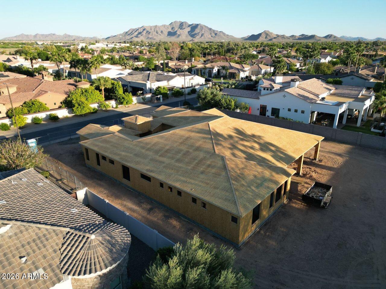 Buyers select your finishes ASAP! Introducing an exquisite custom home in the City of Chandler. This remarkable 6-bedroom, 6.5-bath residence will be thoughtfully constructed, with each bedroom boasting its own ensuite bath for ultimate privacy and convenience. Enjoy the 10 & 12 ft ceilings, a guest room, dedicated fitness room & upgraded kitchen with a walk-in butlers pantry. 
All nestled inside one of Chandler's most sought-after gated communities, surrounded by magnificent multi-million dollar estates, lush greenbelts, and serene parks. Built with durable 2x6 construction and a stylish tile roof, this home features an extended covered patio pool & spa, covered ramada with an outdoor kitchen all on a 22,000 SF lot. 
Don't miss the opportunity to make this exceptional property your own This home is near completion (July 2026), buyers can select the kitchen counters, cabinets, finishes, plumbing, light fixtures and flooring by May 15th, 2026 !