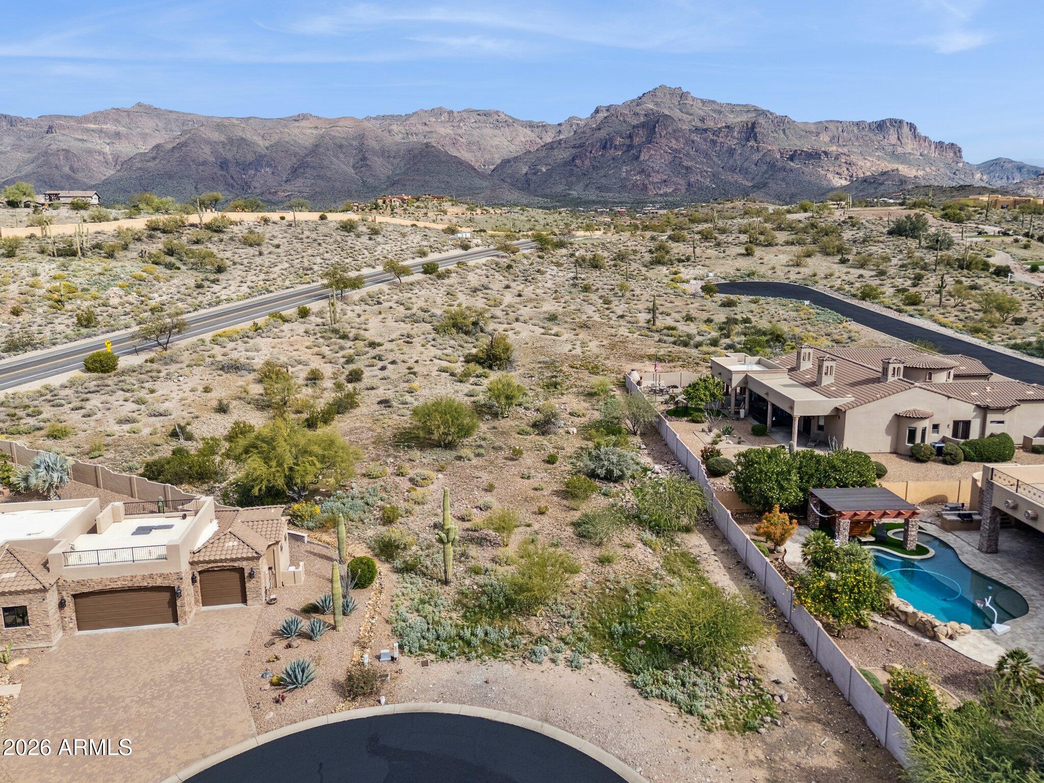CHECK OUT THE DRONE VIDEO AND PHOTOS SHOWCASING THE BEAUTIFUL BACKDROP TO THIS LOT JUST WAITING FOR SOMEONE TO BUILD THEIR DREAM HOME HERE! QUAIL CANYON IS A GENTLE HILLSIDE GOLF COURSE COMMUNITY. THIS LOT IS NESTLED BETWEEN SUPERSTITION & DINOSAUR MOUNTAINS. THIS LOT HAS BREATHTAKING VIEWS. READY TO BUILD WITH UNDERGROUND UTILITIES. EASY COMMUTE TO PHOENIX, MESA & SKY HARBOR AIRPORT--ONLY MINUTES AWAY FROM FREEWAY 60. COME & EXPERIENCE THE TRANQUILITY, PEACE, & LOVELY DESERT VEGETATION.