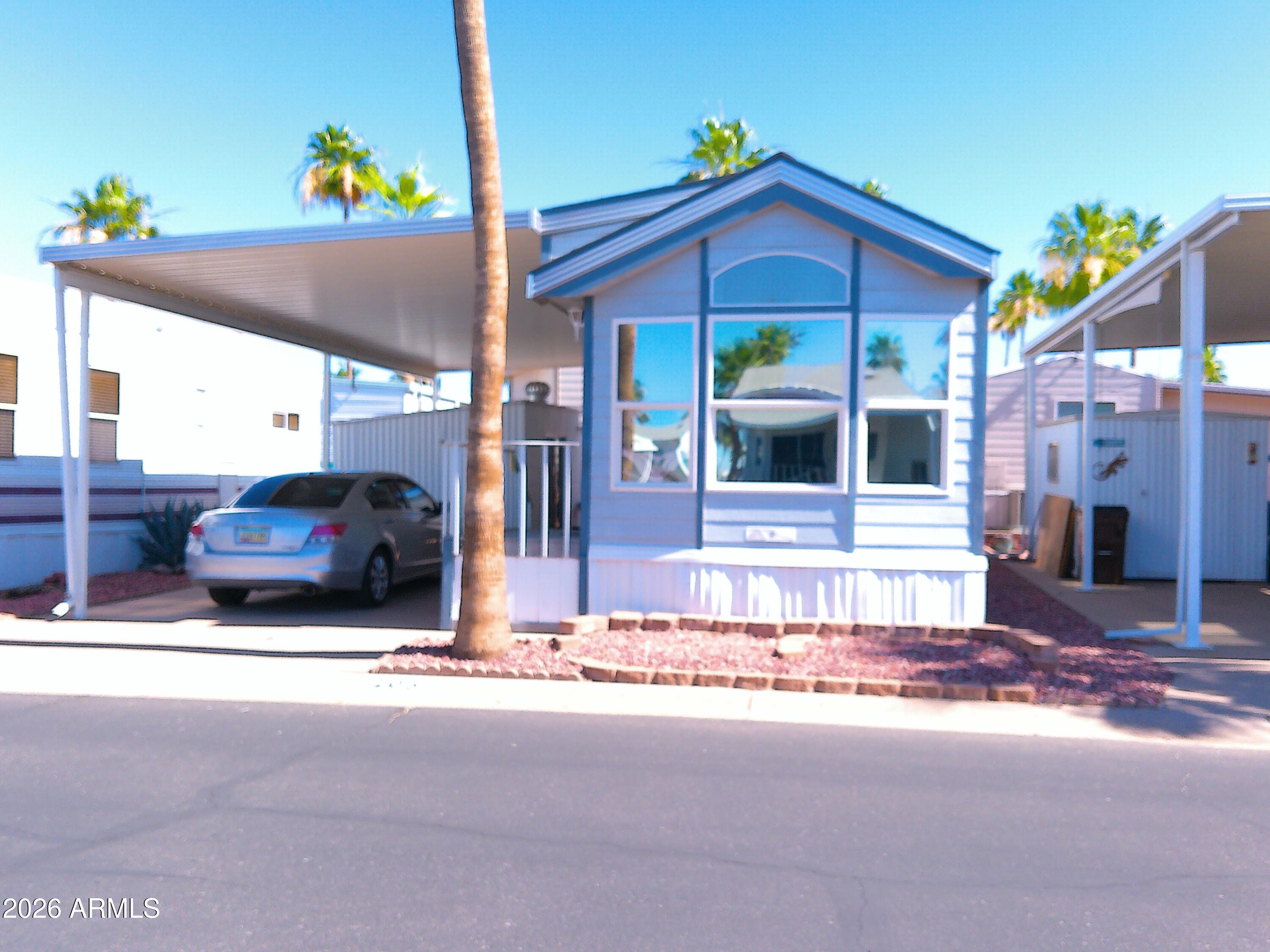 2008 Cavco.1bed/1bath. Approx 400 sq ft plus 120 sq ft finished shed w/storage, bed, stacked washer/dryer and dedicated water heater. Great location just steps from the clubhouse & all the activities. There is a lovely, private back patio area w/BBQ, outdoor heater & patio furniture, making this the perfect choice for the buyer who enjoys outdoor living. The home is fully furnished. Love seat, 2 rocker recliners & corner TV nook in living area. Dining area w/wrap around counters. Kitchen w/full size flat top stove, built in microwave, fridge/freezer & pantry. Tub/shower combo & linen storage in bath. Vaulted ceilings, fans, skylights, upgraded flooring. Plumbed for water softener. New A/C unit in 2023.