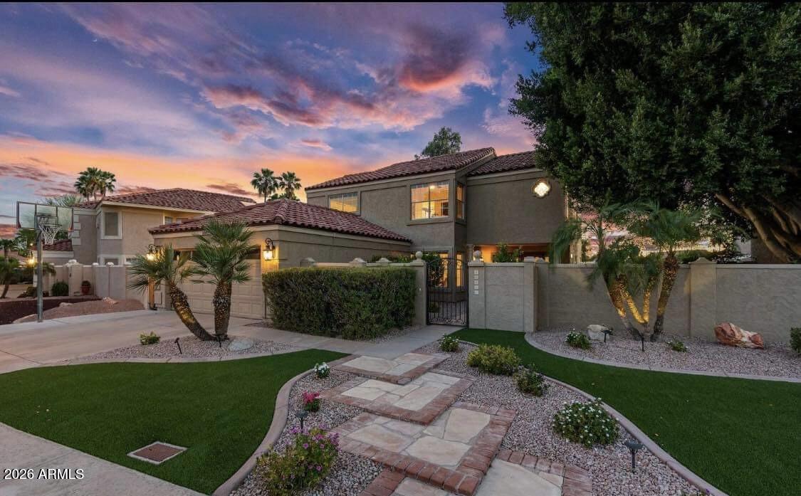 Seize the chance to own an exquisite home nestled alongside the 14th green of the Arrowhead Ranch CC Golf Course ready for early July move-in. This prime location boasts tranquility in a serene neighborhood just minutes away from the 101 Freeway, as well as shopping, dining, hospitals (Phoenix Children's Specialty Arrowhead and Abrazo) and top-notch schools. Enjoy the luxury of unwinding on your very own private covered balcony, offering breathtaking sunset views. Meticulously maintained, this home exudes the charm of a model residence, boasting tasteful renovations that perfectly blend comfort and elegance. The kitchen has been thoughtfully redesigned, featuring Espresso Alder cabinetry with soft-close doors and drawers, complemented by Alaskan White Granite countertops and modern stainless steel appliances. Other recent upgrades include, roof underlayment replaced, Pool tiles replaced & pool resurfaced in 2016, Variable speed pool pump in 2022, R-38 Attic Insulation, Six panel interior doors with satin nickel hardware, Beautiful double doors with stained glass in the front entry, Recessed lighting and, Engineered, glued down, wood floors and 20" tile downstairs and in the 4th bedroom, stairs, and upstairs hallway/bathrooms, 2" faux wood blinds throughout, Sunscreens for all the windows, 5 1/2" baseboards, Wood burning fireplace with tile surround in living room, Wood burning free standing firepit on patio, Garage cabinetry, Stainless steel refrigerator, Exterior door added to back yard for easy access grilling, Downstairs bathroom has exterior door to pool, Two huge Ficus trees provide an abundance of shade and privacy, All bathrooms have granite counters and the master bathroom has custom extra deep counters for more space, Kitchen cabinetry also includes crown molding, a wine rack, and under lighting, Outside rear patio cover has been raised about 8", tongue and groove paneling added to underside of it, and has lighting, 4th bedroom (set up as office) has french doors leading to the balcony, Master bedroom also has access to the private balcony, View fencing (also has an access gate) to the 14th green and views of the 14th and 15th holes of this private golf course, Bronze plumbing fixtures in the upstairs bathrooms, Master shower consists of Travertine stone, Jetted soaking tub with travertine surround, Kenmore washer and dryer upstairs and they convey with home.