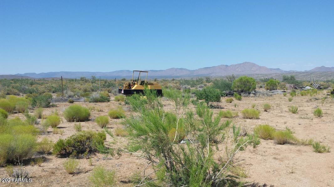 Calling all investors and developers. This 38 plus acre parcel is ideally located adjacent to Old Highway 93 and the new Highway 93 corridor planned as Interstate 11. Situated just a few miles south of Interstate 40 and approximately 25 miles from Kingman Arizona this property offers excellent long term investment potential. Opportunities may include custom homes residential development and other uses consistent with the Mohave County General Plan. The property has been surveyed and is located near existing custom homes in an area positioned for future growth. Some building materials remain on site. Buyer to verify all facts and perform due diligence regarding regarding zoning utilities and development potential. Seller and listing agent have a former familial status.