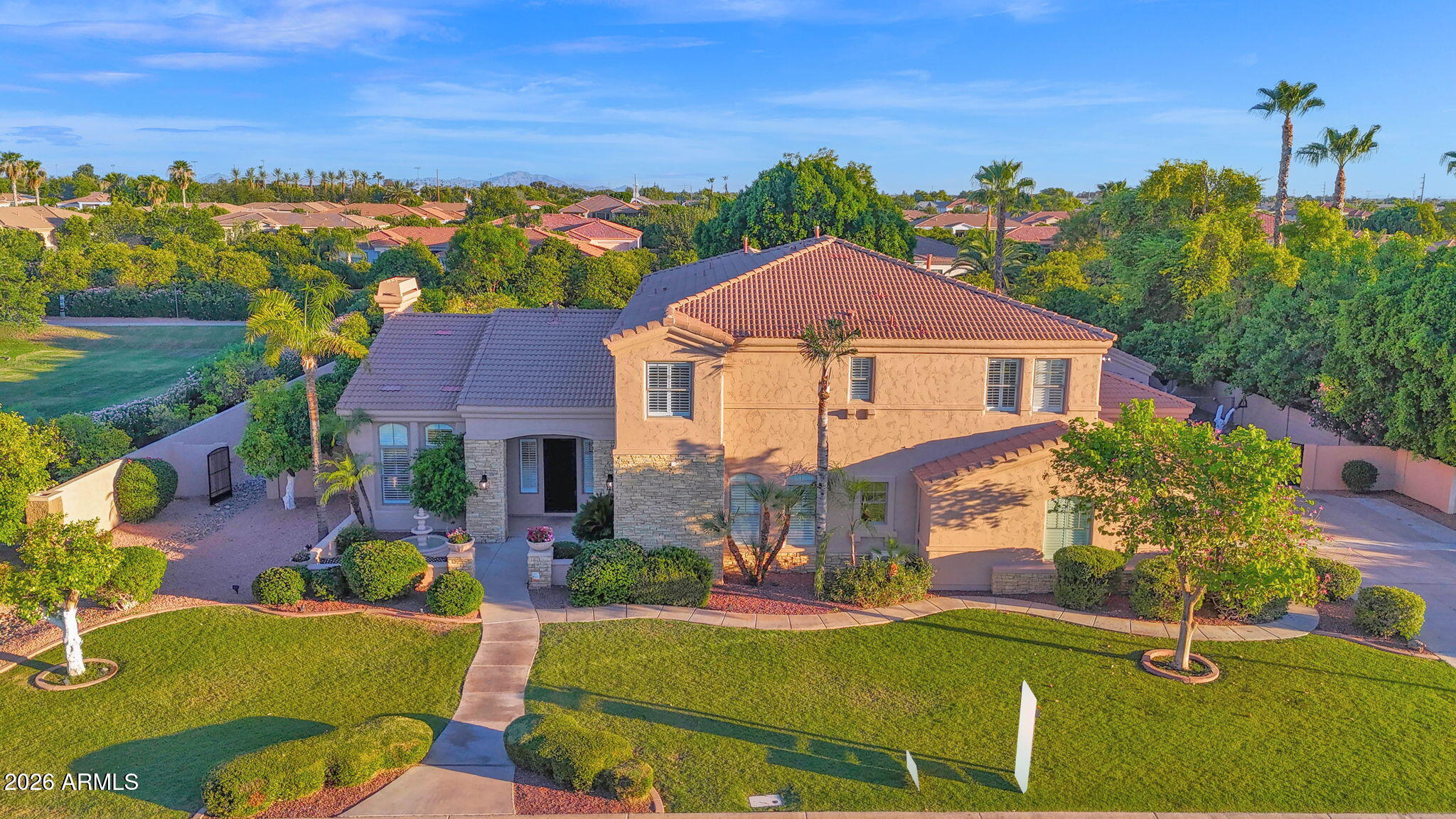 Discover the epitome of luxury living in the prestigious gated community of Arboleda. This exquisite 5 bedroom, 4.5 bathroom, two level, semi custom home is perfectly situated on a sprawling 6/10 acre lot right next to Arboleda Park, which contains sport courts, children's playground and ramada. Add to that a 1023 square foot separate casita with 2 additional bedrooms, 1 full bathroom, full kitchen, full laundry with wash sink, gas fire place, private outdoor porch, and a private garage with cabinets for storage. This residence caters to both comfort, sophistication and generational living possibilities. Come see all the recent upgrades. The gourmet kitchen is a chef's dream, featuring custom cabinets, built in side by side fridge/freezer, Asko dishwasher, Wolf double ovens, Wolf radiant cooktop, Wolf built in microwave, ice maker, quartz countertops, and sizeable eat in kitchen. Walk-in pantry. The oversized family room provides a welcoming space for relaxation and gatherings. Main floor also features a private en suite bedroom and a private office with built in book cases. 
Formal occasions are well accommodated in the combined formal living room with gas fire place and dining room, defined by 12 foot ceilings that enhance the home's spacious feel. Flooring throughout is a tasteful mix of new wood look plank tile and carpet, laying the foundation for your personal decor. Shiplap, wainscoting and crown molding add to the beauty of this home. The upstairs primary suite is a true retreat with sitting room space, two walk in closets and your own private balcony over looking the backyard. The primary bathroom features double counter sinks, a jetted tub, large shower with two side entrances and two private water closets for ultimate privacy. 3 additional bedrooms upstairs. One with its own bathroom and the other two are Jack and Jill with large bathroom in between, each having private sink/counter space. An additional bonus room offers flexibility for your lifestyle needs. Plantation shutters throughout. 3 car extended garage stays cool during Arizona summers with A/C split, built in cabinets for storage and epoxy flooring. And a 4th single car garage. Full exterior new paint. Dog run. Outdoor living is equally impressive. An outdoor oasis including a raised pergola, a diving board depth pool with child's play shelf, water features, spa and fire pit. Patio runs almost the length of the entire back of the house and provides shaded space for outdoor dining and leisure with a built in gas BBQ, burner, fridge and wash sink. Backyard includes multiple mature citrus trees (orange, lemon, grapefruit) all maintained with low-cost flood irrigation. Ample storage throughout the home adds to the convenience and appeal of this remarkable property. Located close to the 202 freeway, residents enjoy easy access to all parts of the Phoenix metro area, including PHX Sky Harbor. With top-rated schools and beautiful parks nearby, including the Mesa Tennis & Pickleball Center at Gene Autry Park, big league dreams, and Kensington Groves Park, this home is not just a residence but a lifestyle choice for those seeking the best in Mesa living.